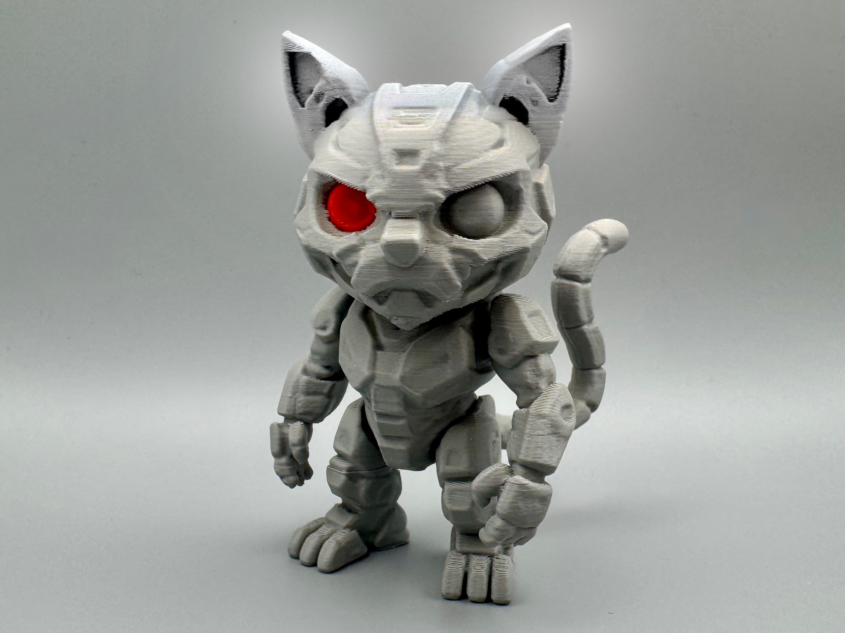 Catinator – Robotic Feline Figurine with Red Eye