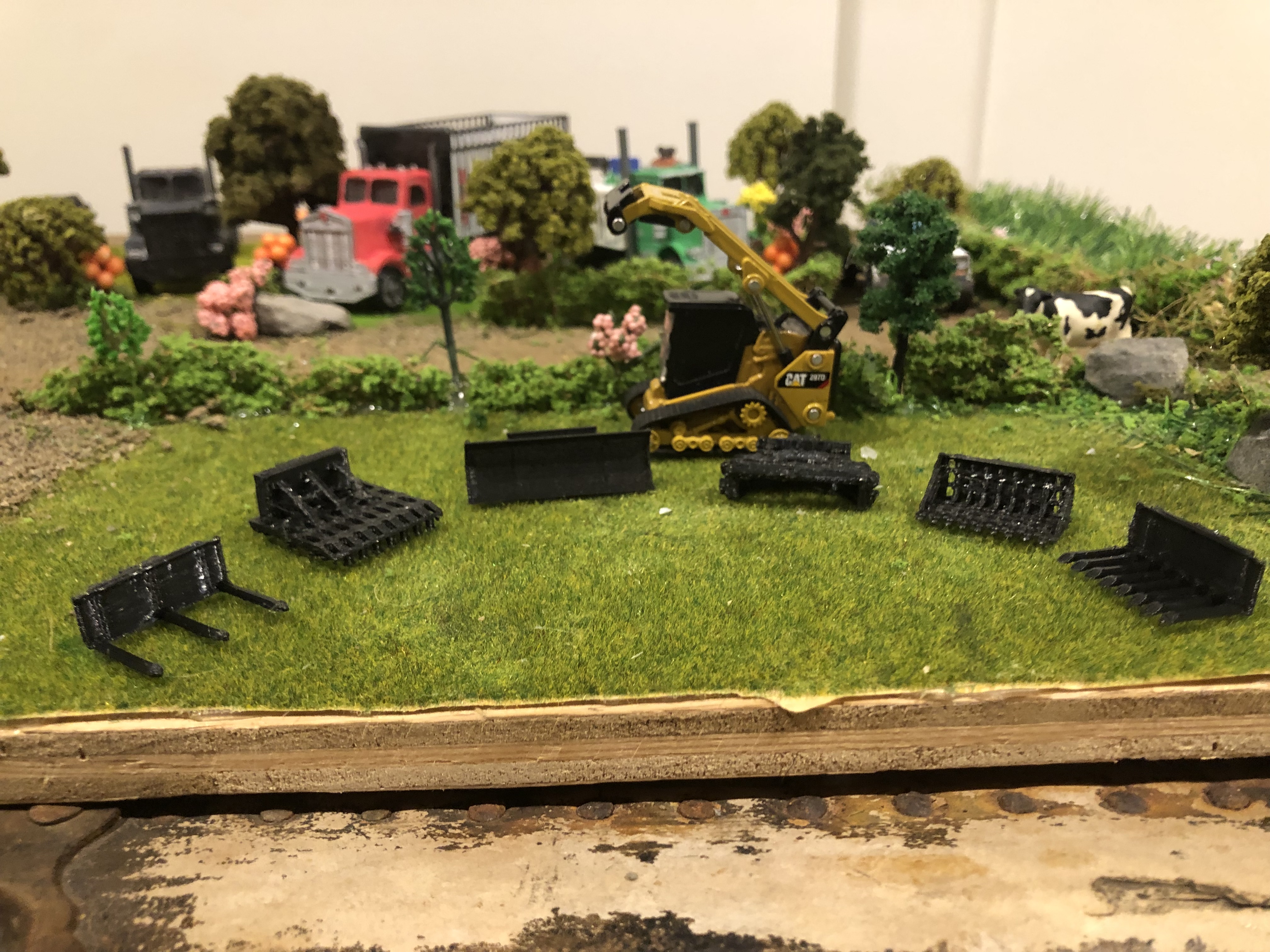 1/64 scale CAT skid steer attachments