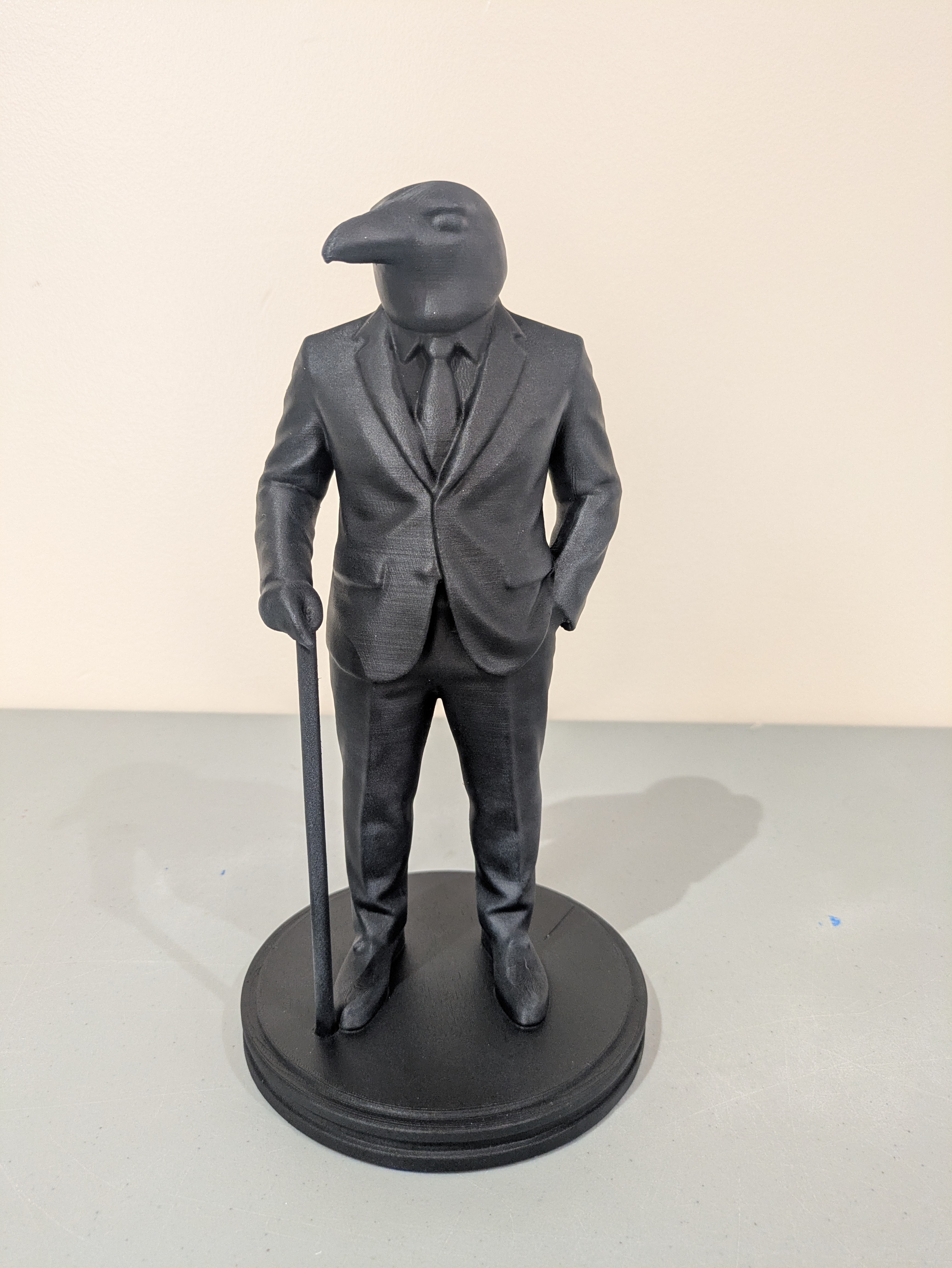 Dapper Raven Man statue