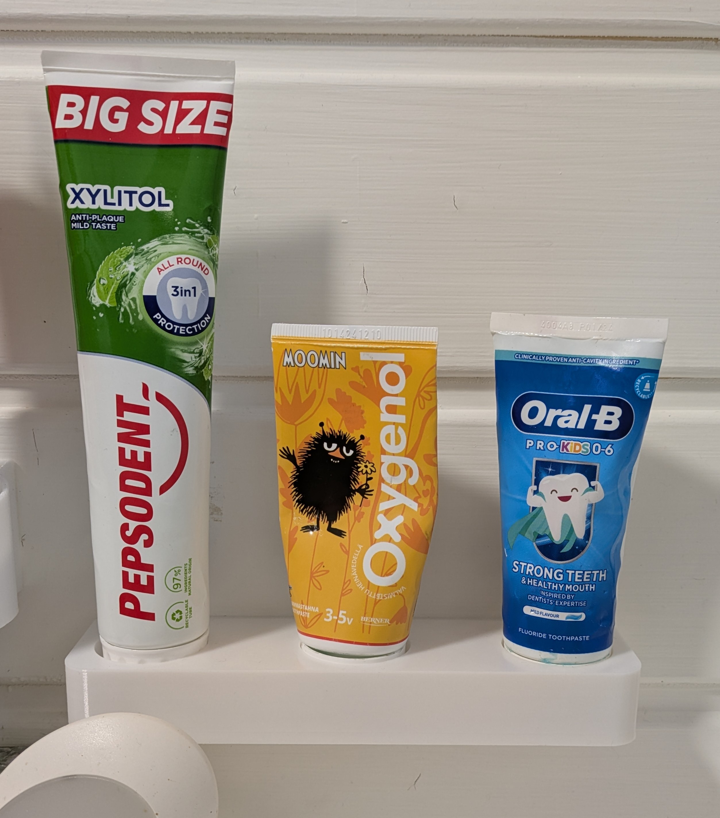 Toothpaste wall holder