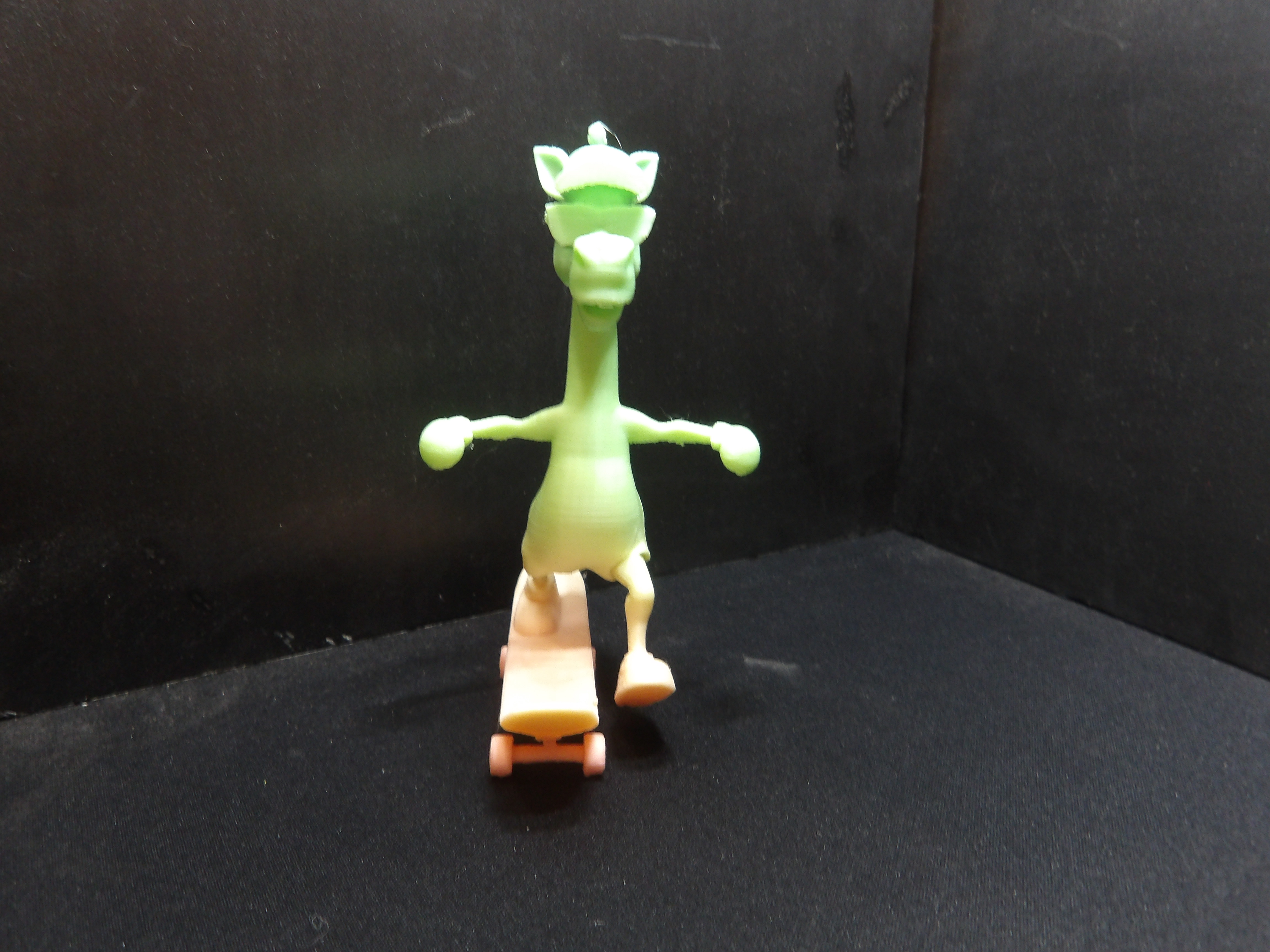 Giraffe skateboarding.