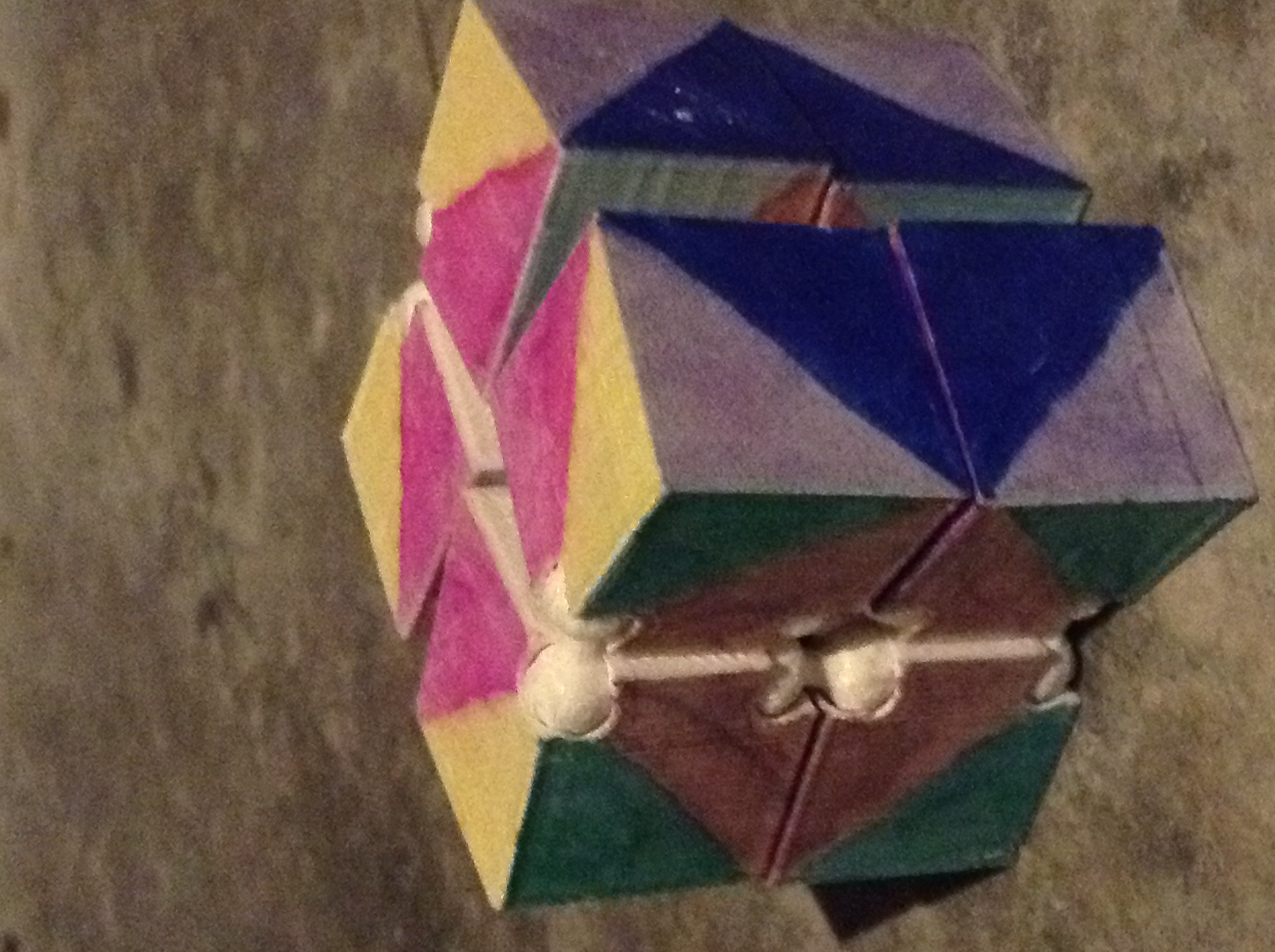 Triply Auxetic Cube