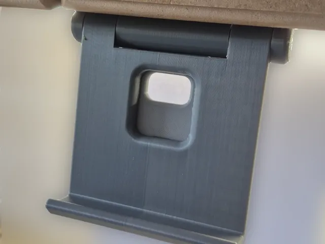 Under cabinet swing down phone stand