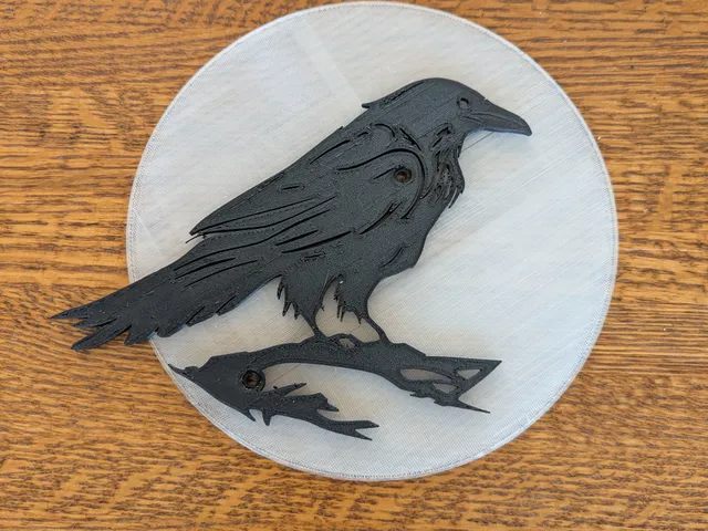 Crow outline in front of moon, more simple