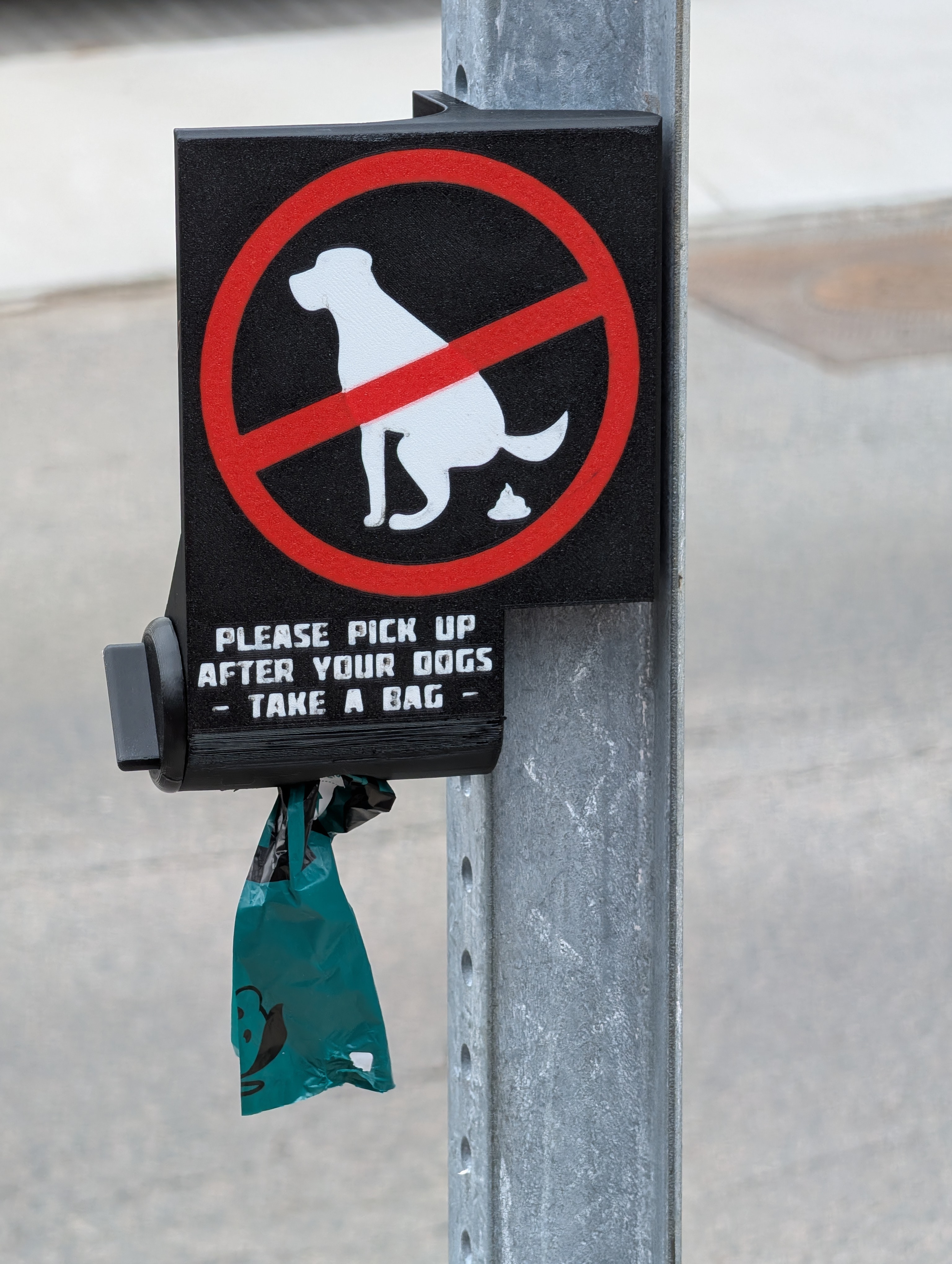 "No Dog Poop" sign and bag dispenser