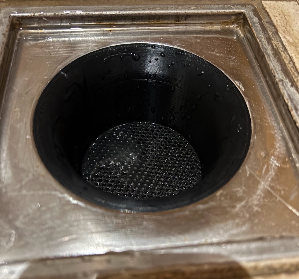 Shower drain strainer