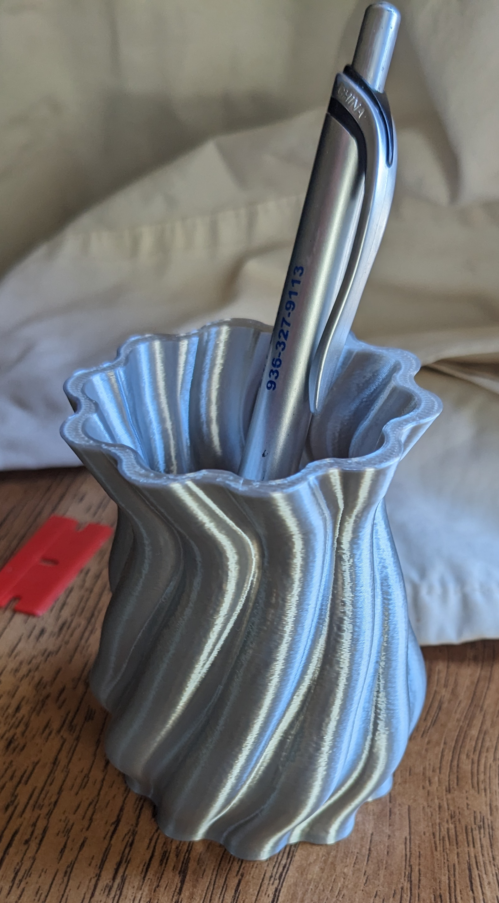 Pencil cup with an organic flowing form.