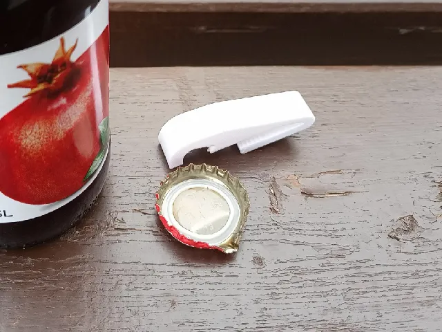 Clip-on bottle opener for caps and belt straps