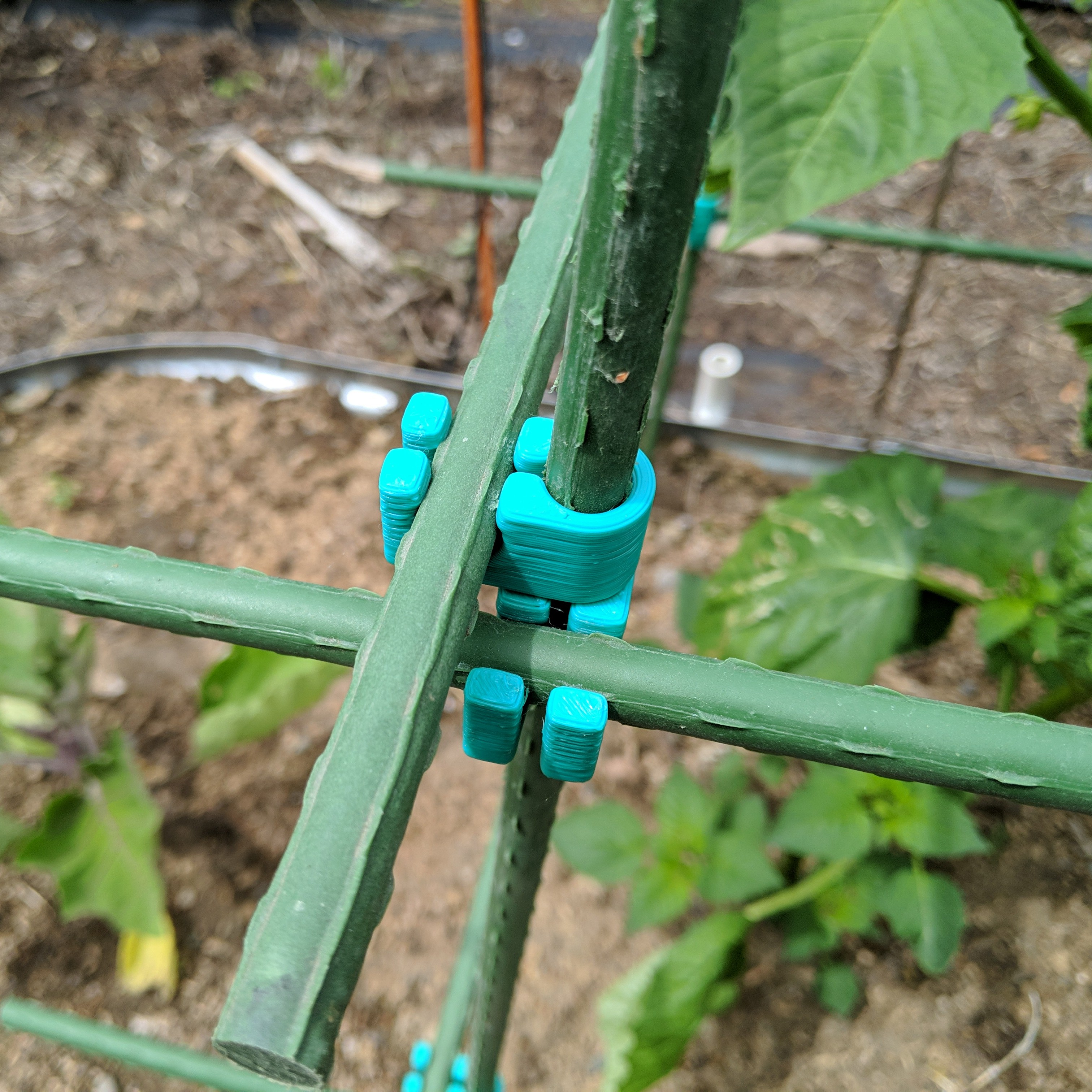 Garden stake connector for plastic coated steel stakes