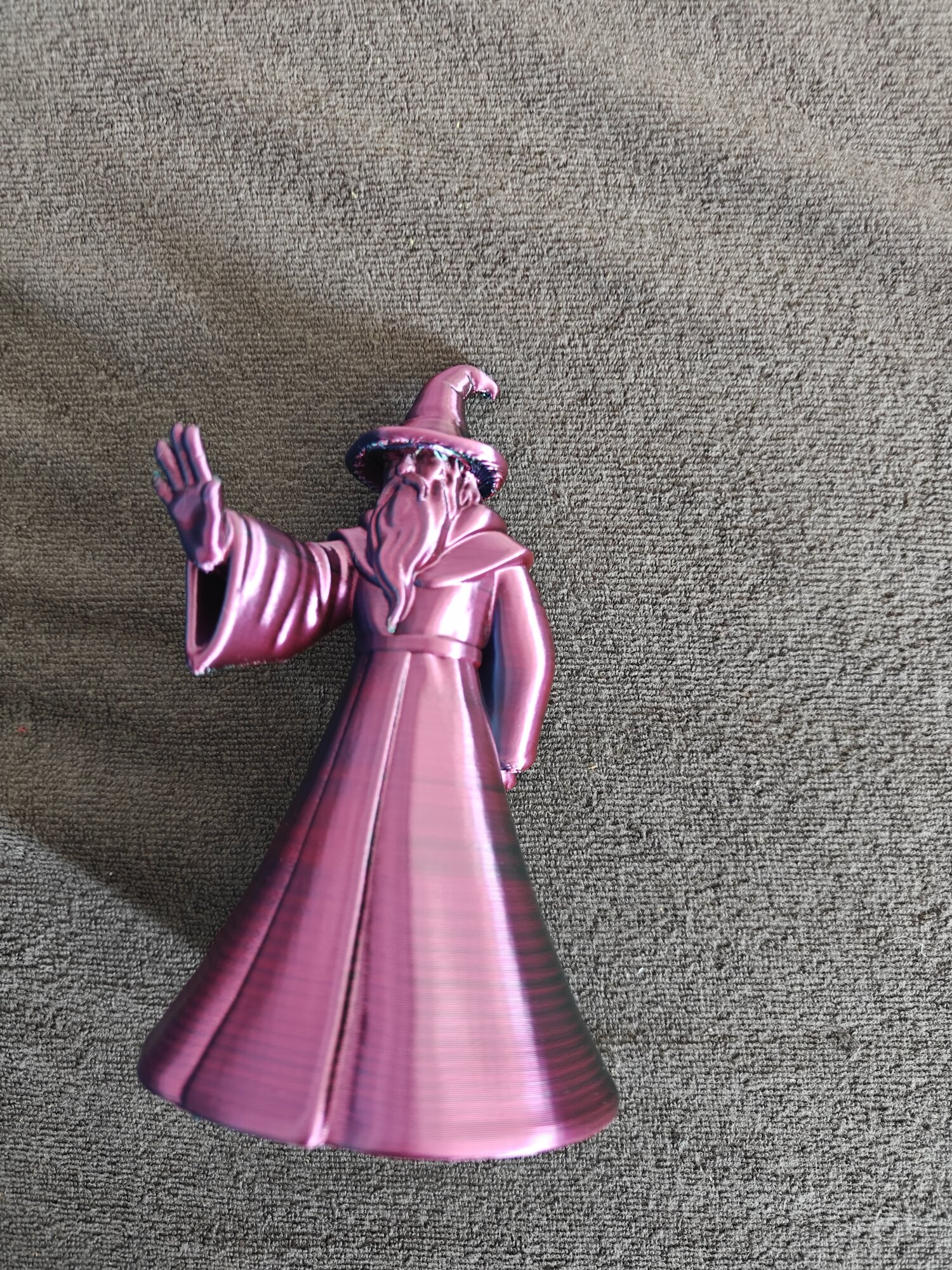 Wizard Figurine — robed mage with a magnet hand
