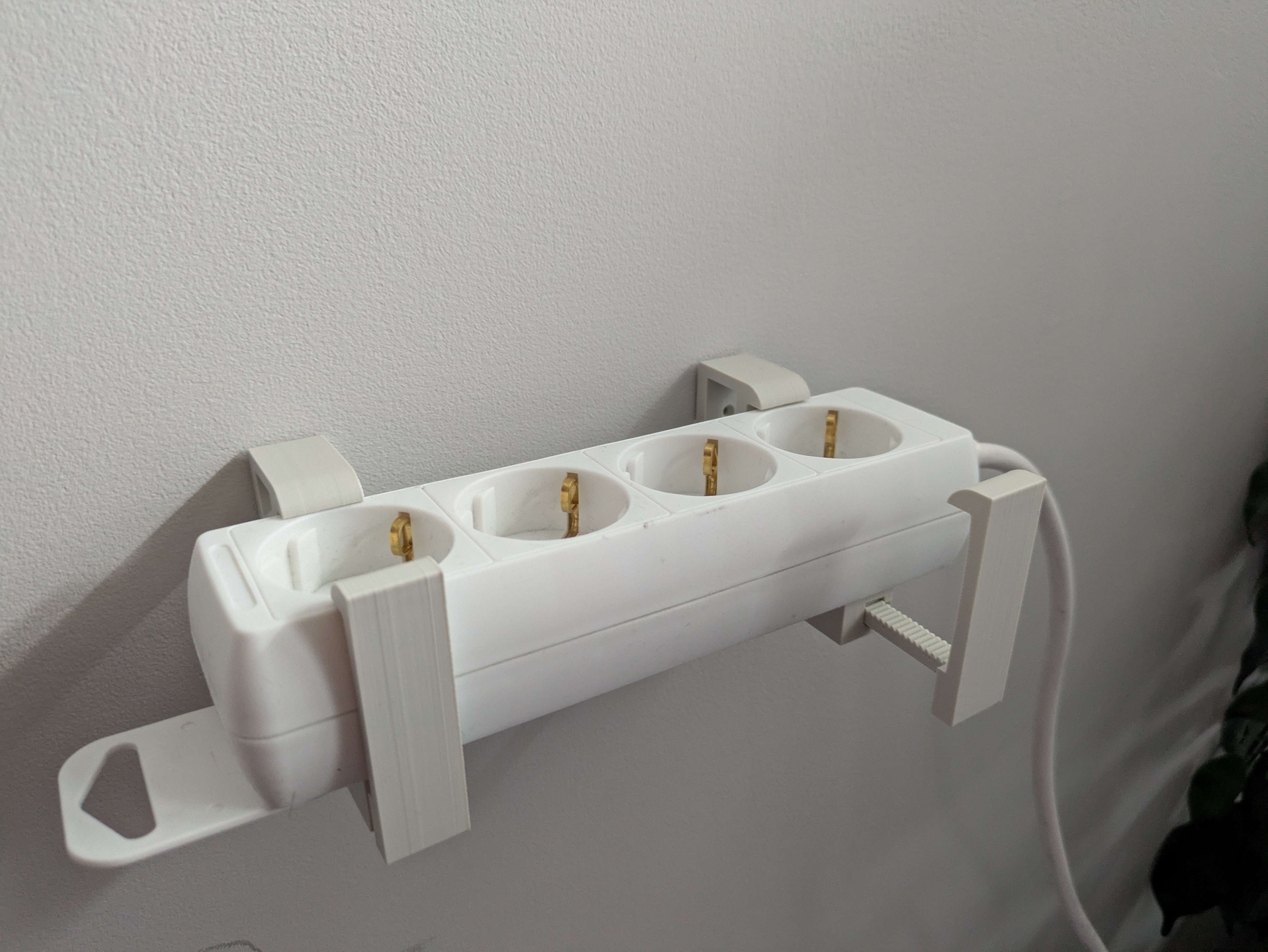 Adjustable powerstrip holder