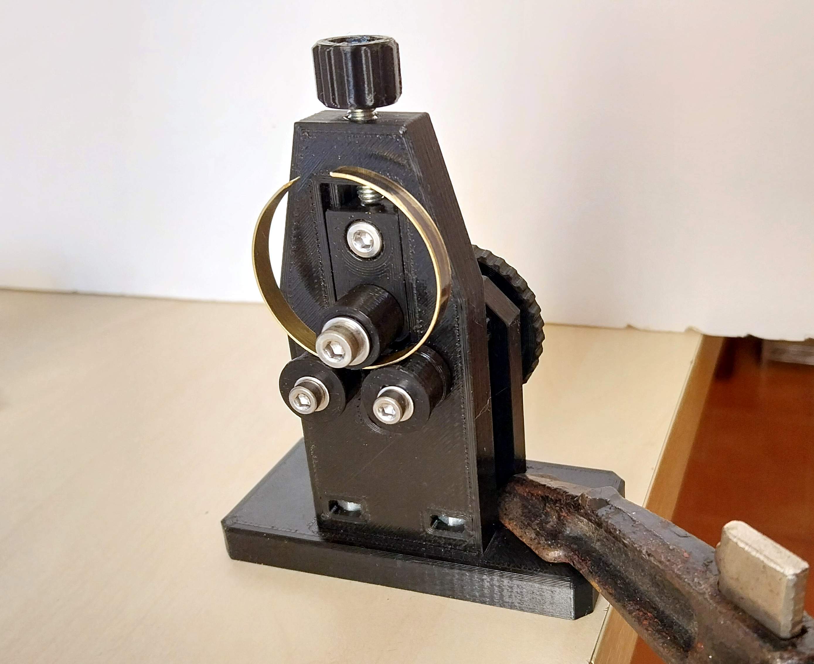 Bending machine for making brass rings for telescope eyepiece holders.
