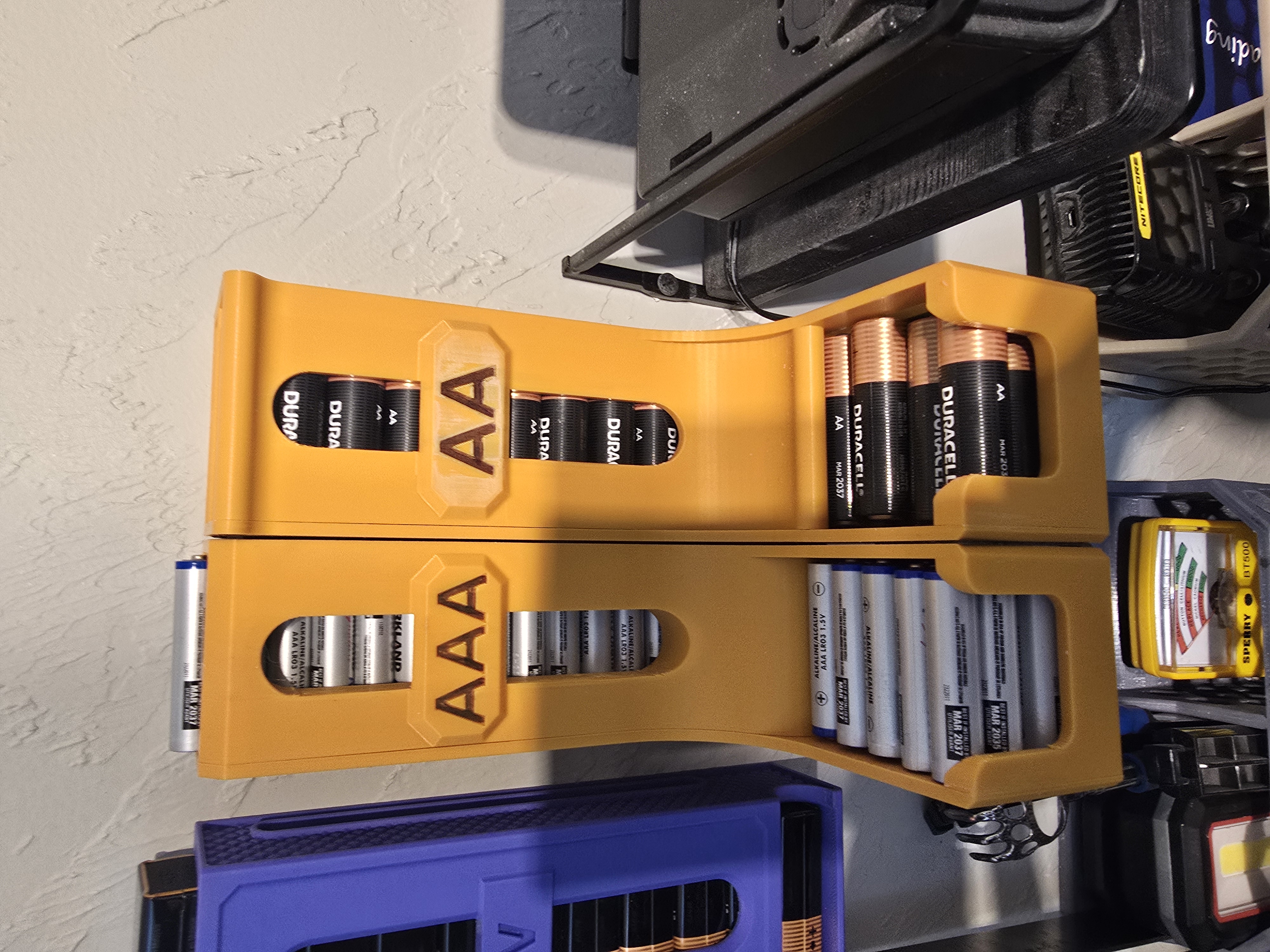Improved AA and AAA battery dispenser, wall mounted or desk