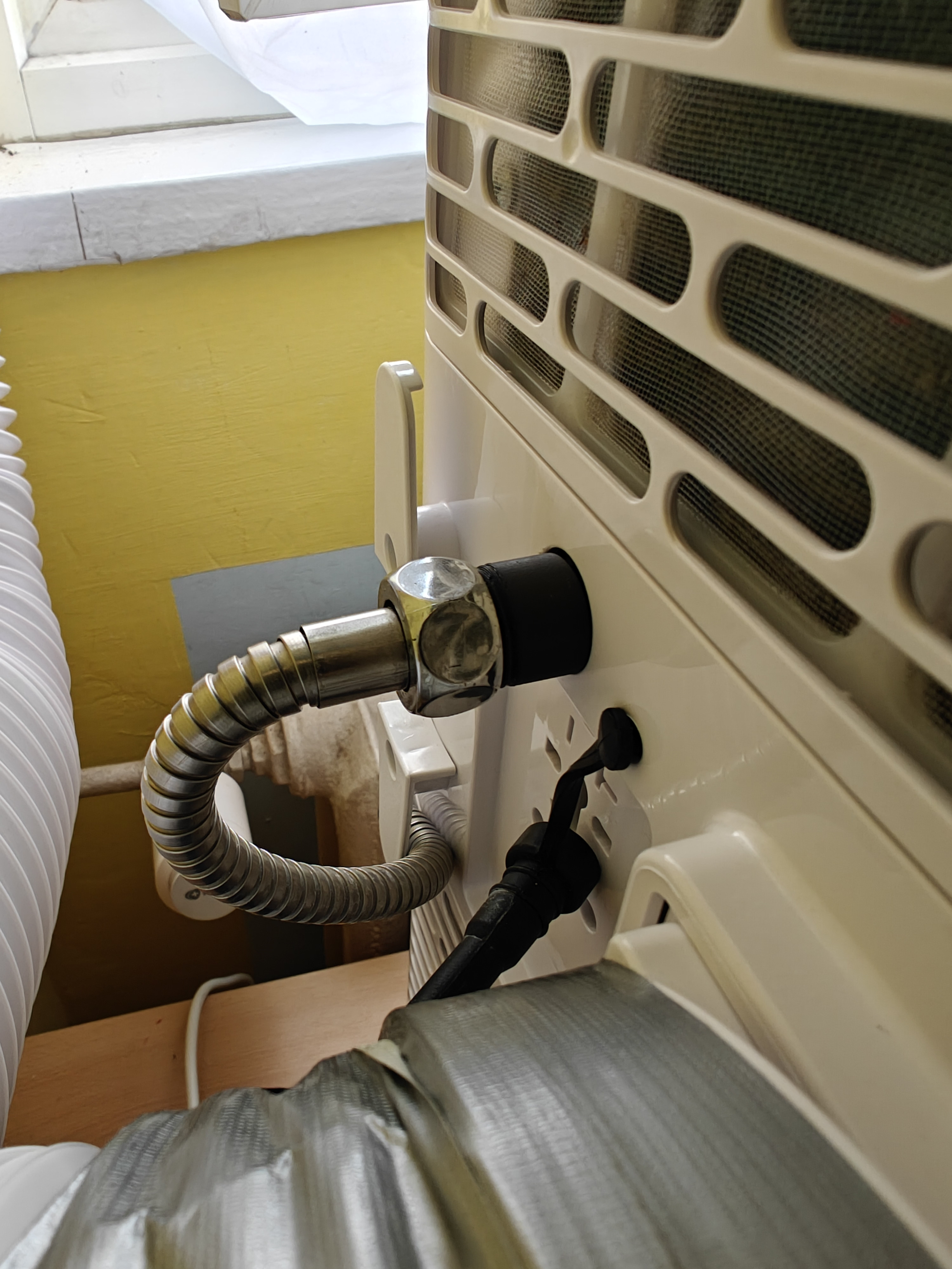 Air conditioner to shower hose connector