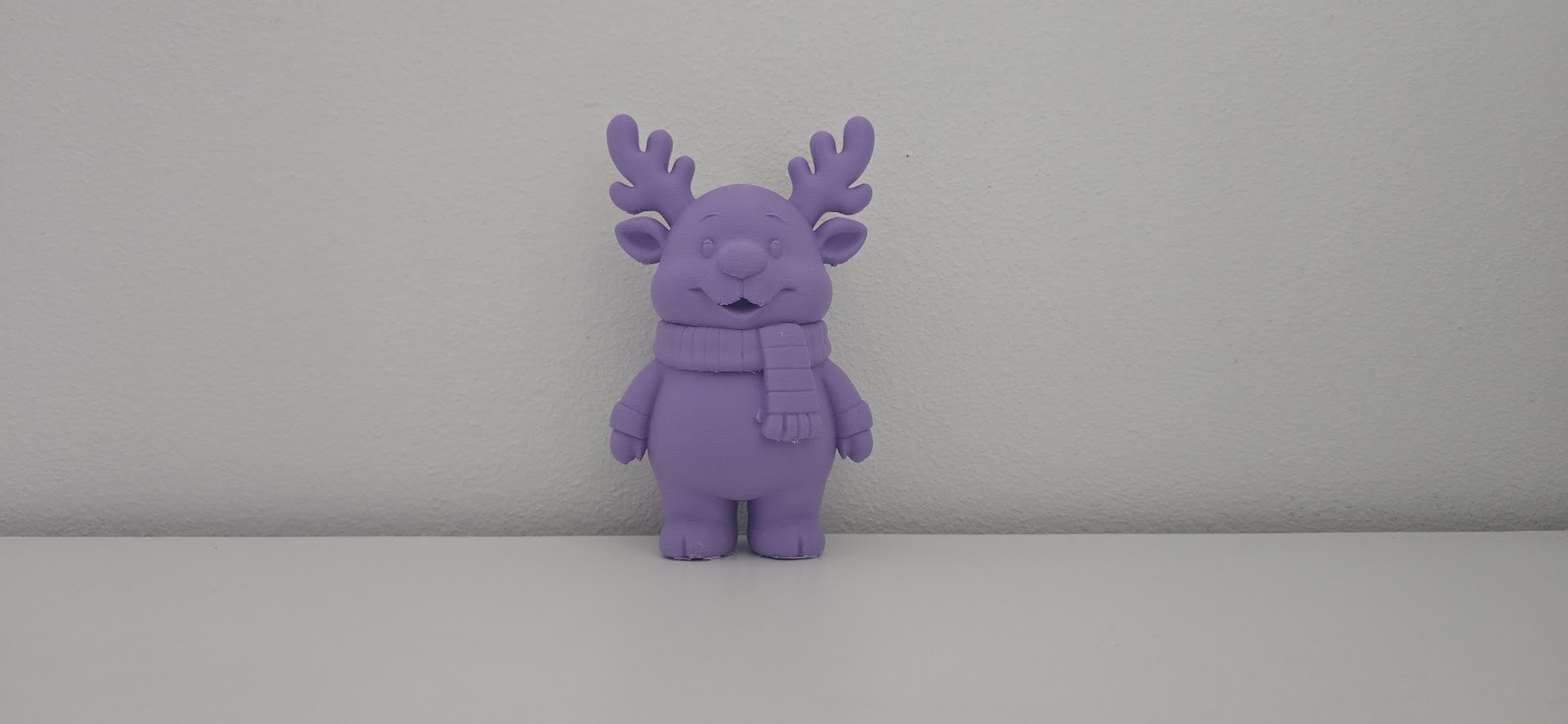 Smiling Reindeer with Scarf Christmas Figurine