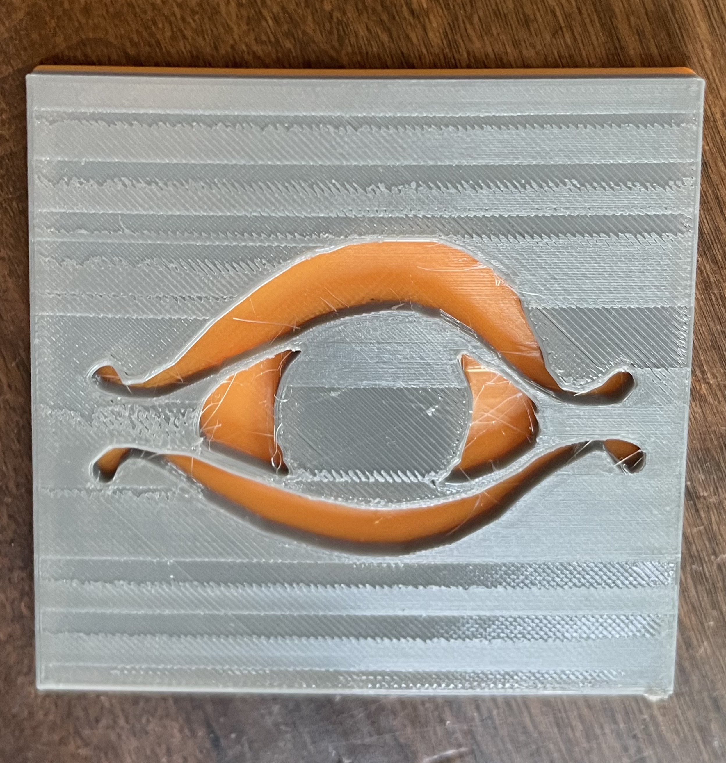 the eye of saron coaster/logo
