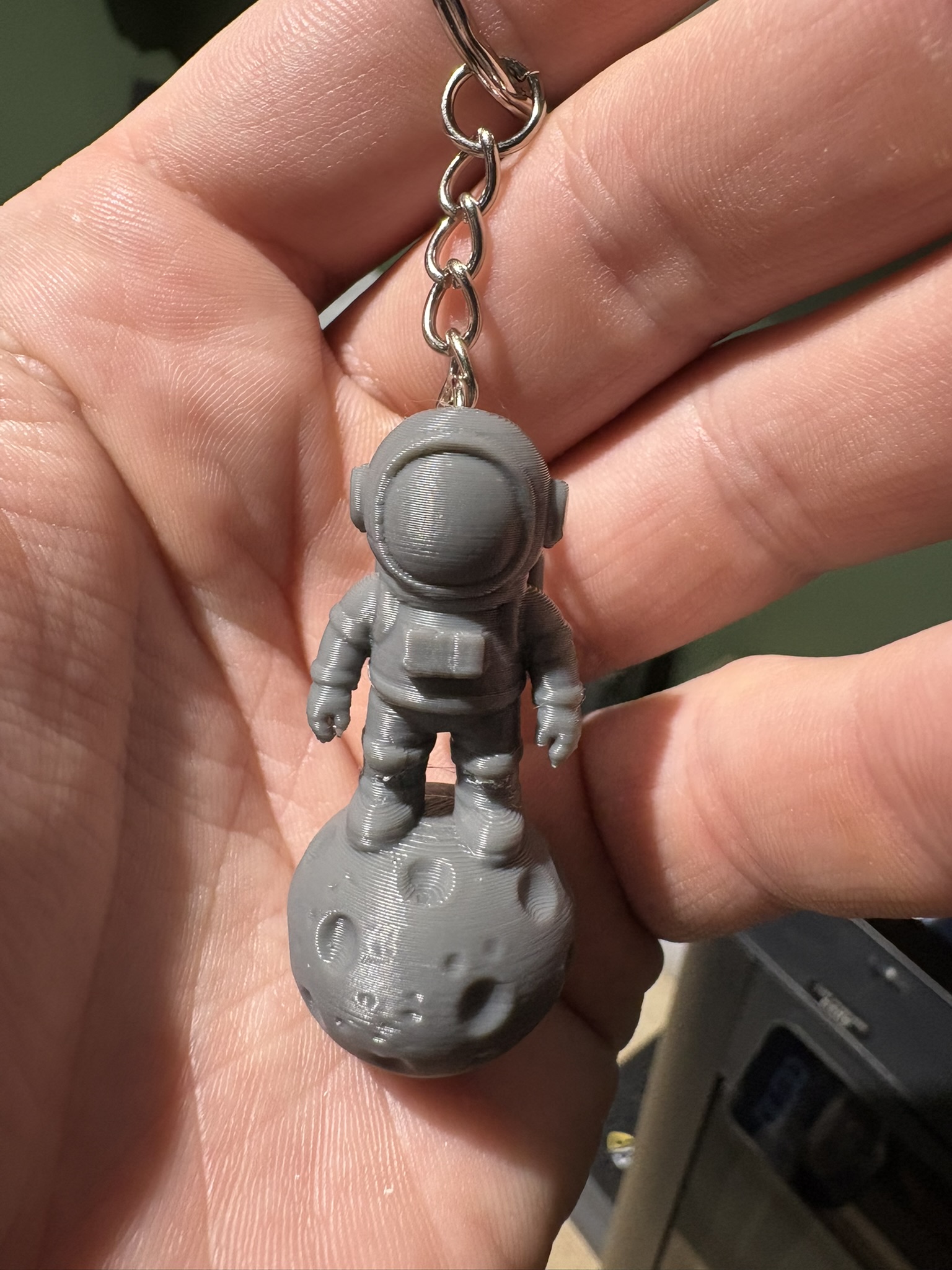 Cute Spaceman On Rock KEYCHAIN