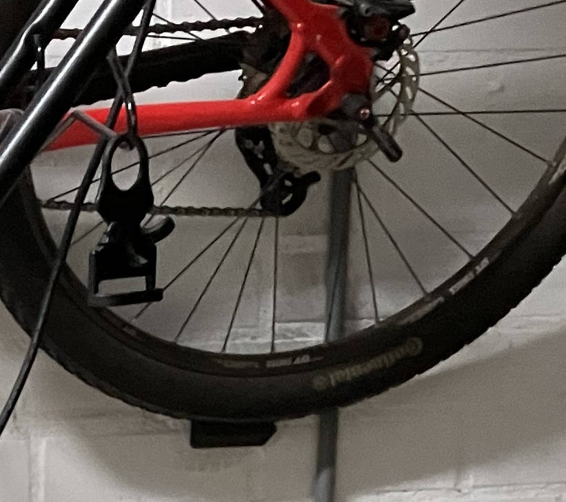 Bike wheel support for use with pedal wall mount