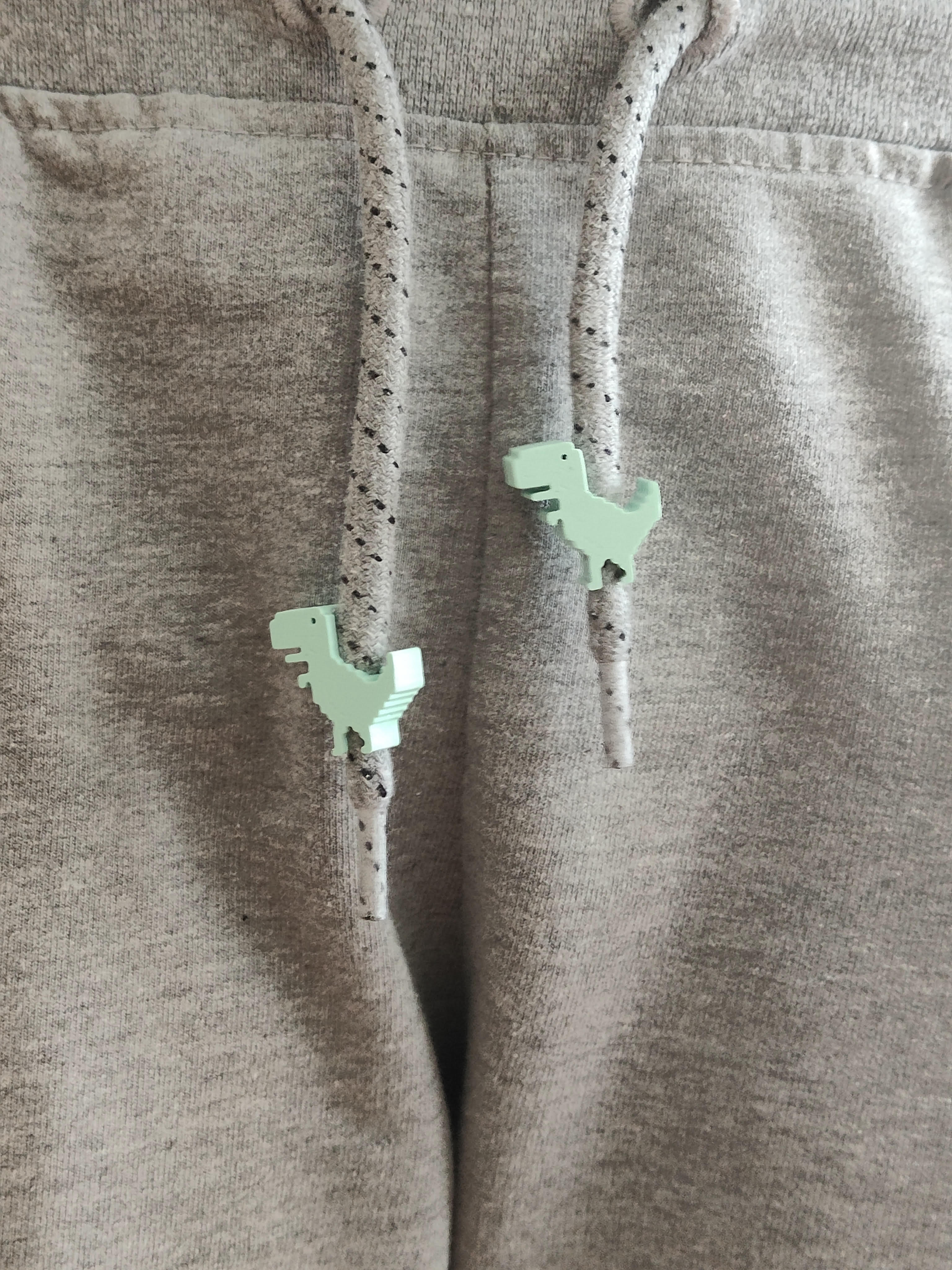 Dinosaurio para cordones