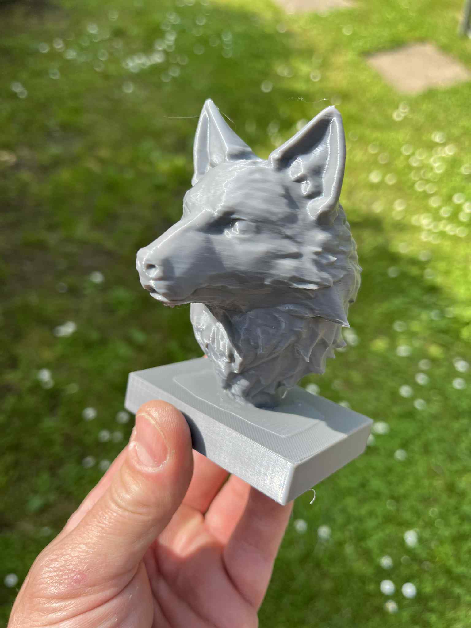 Wolf bust on pedestal