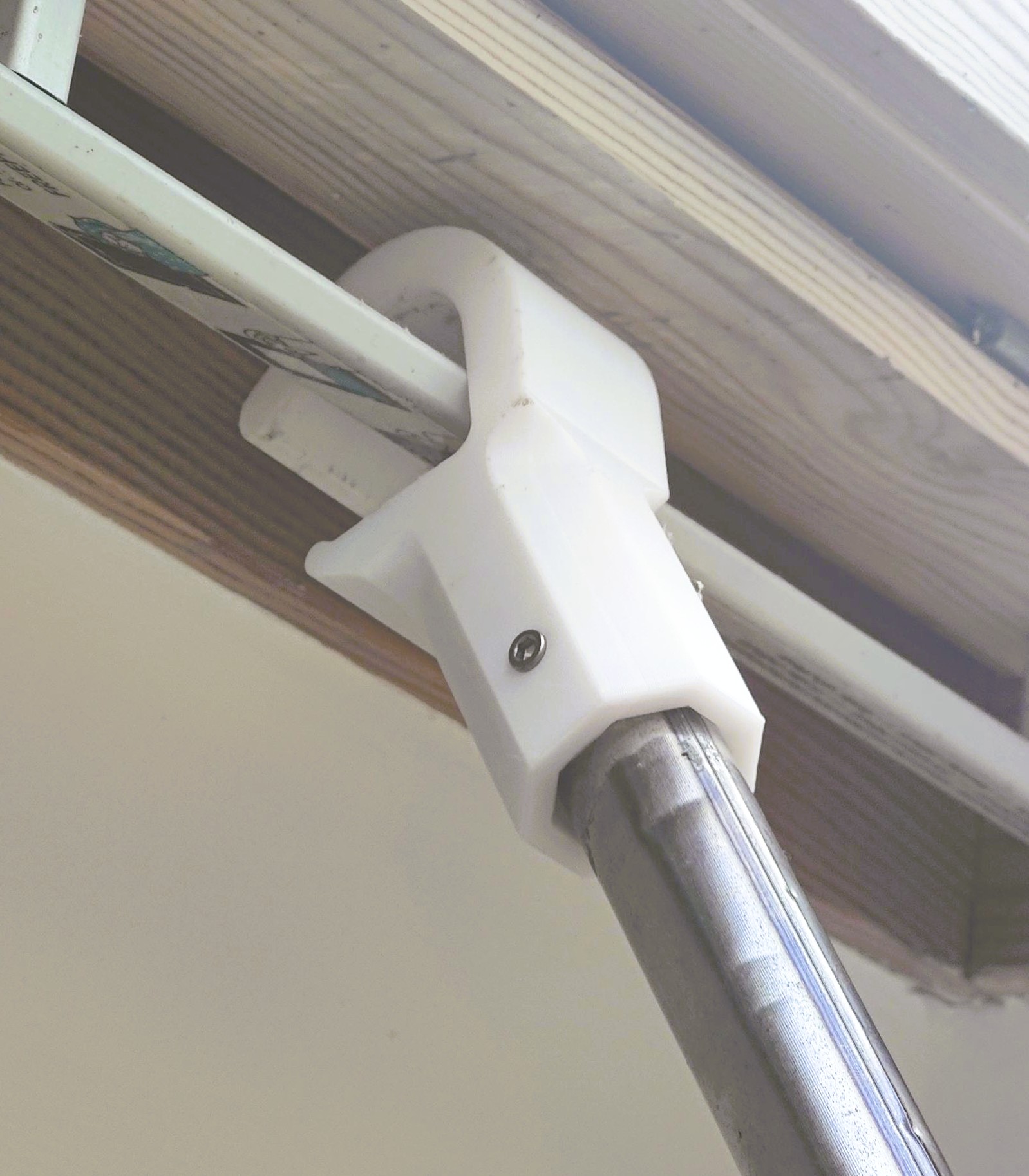Velux hook for centre pivot roof window