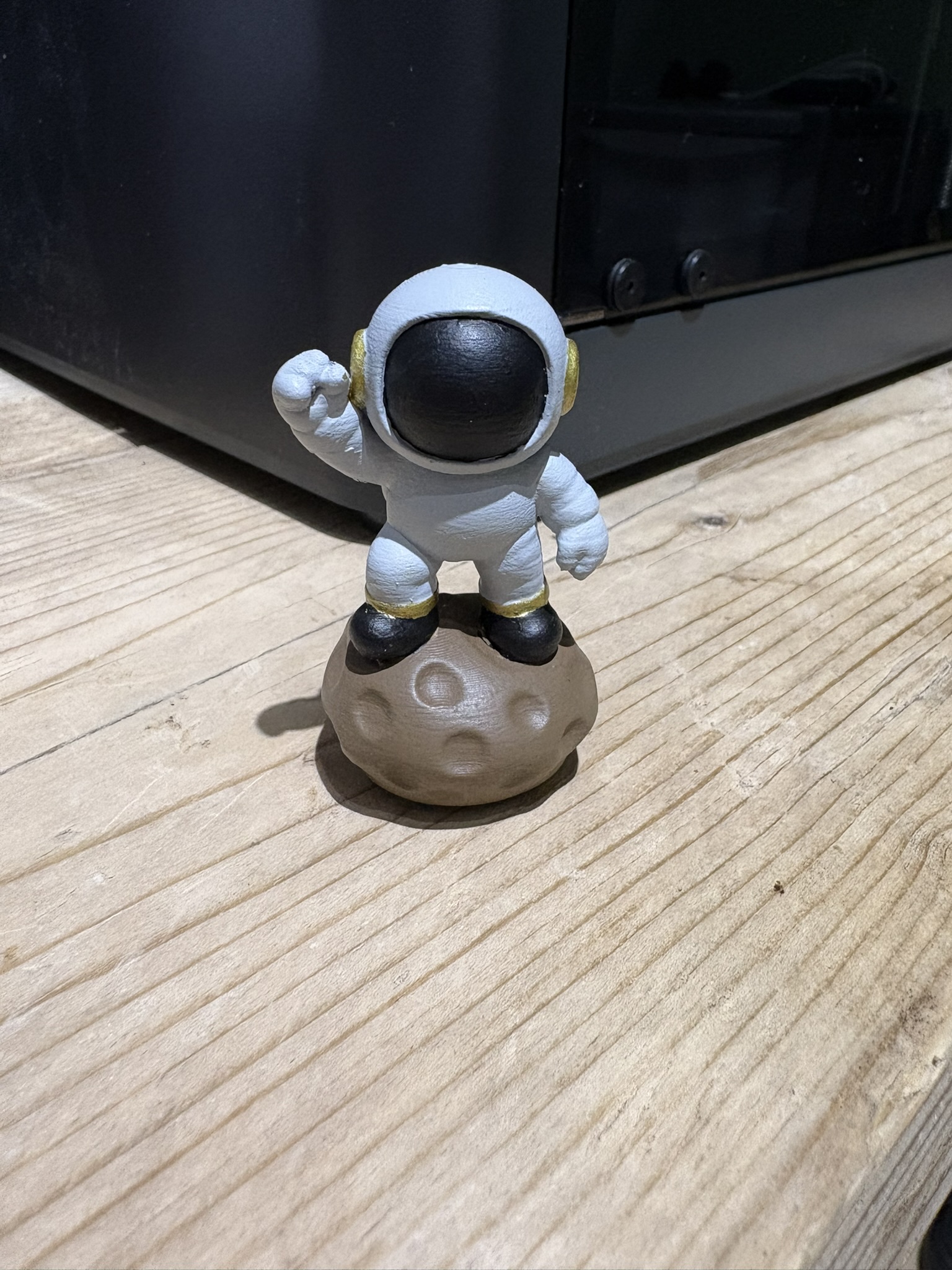Mini Spaceman on rock fist pump