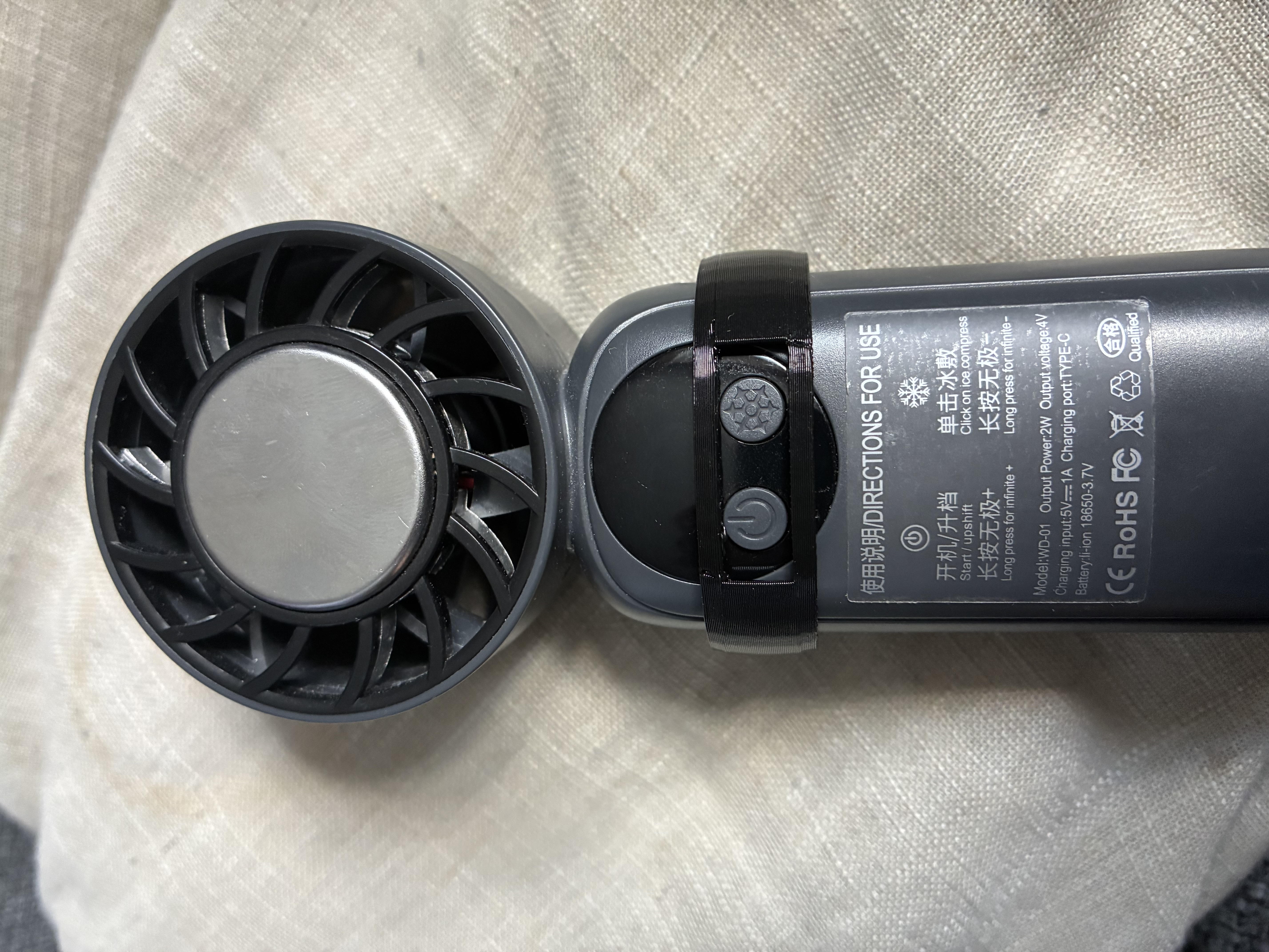 Handheld fan button guard