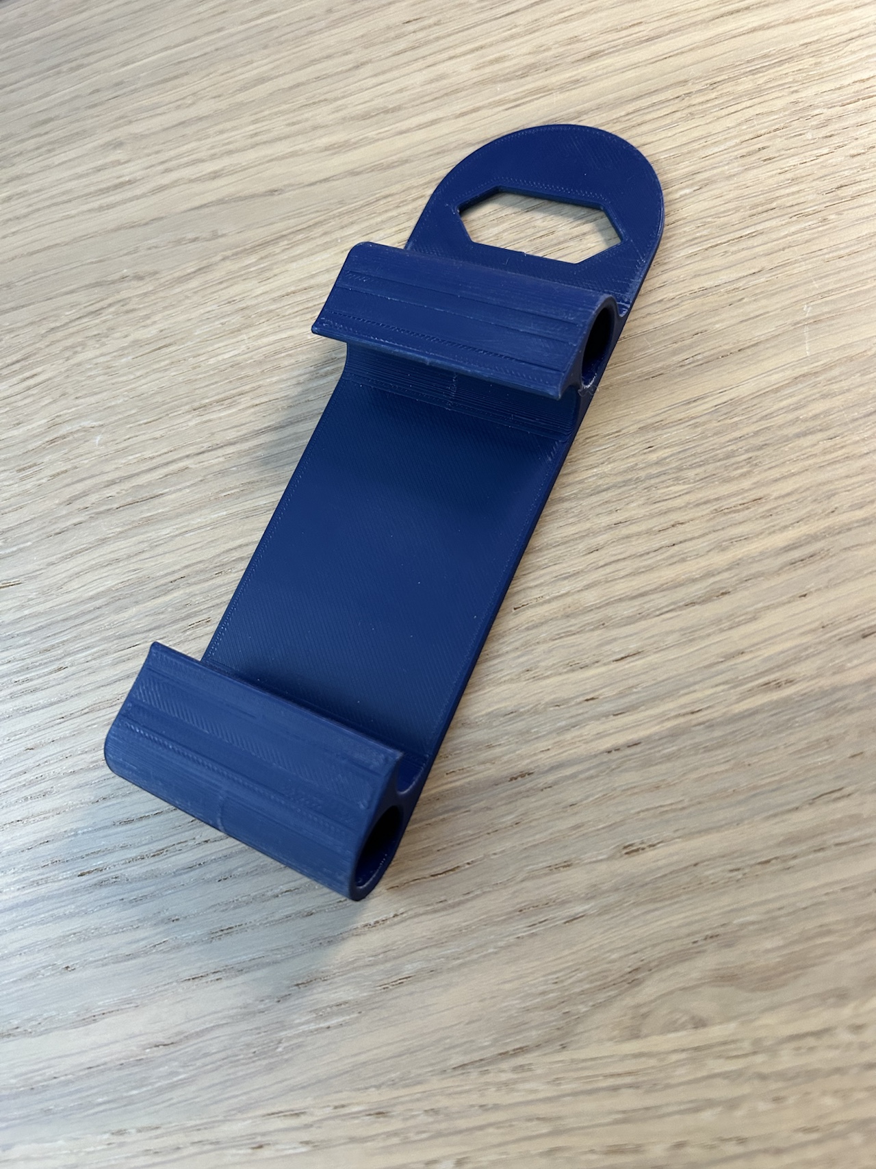 Smartphone socket holder with cable manager.