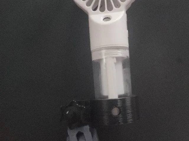 handheld fan holder to articualting arm link
