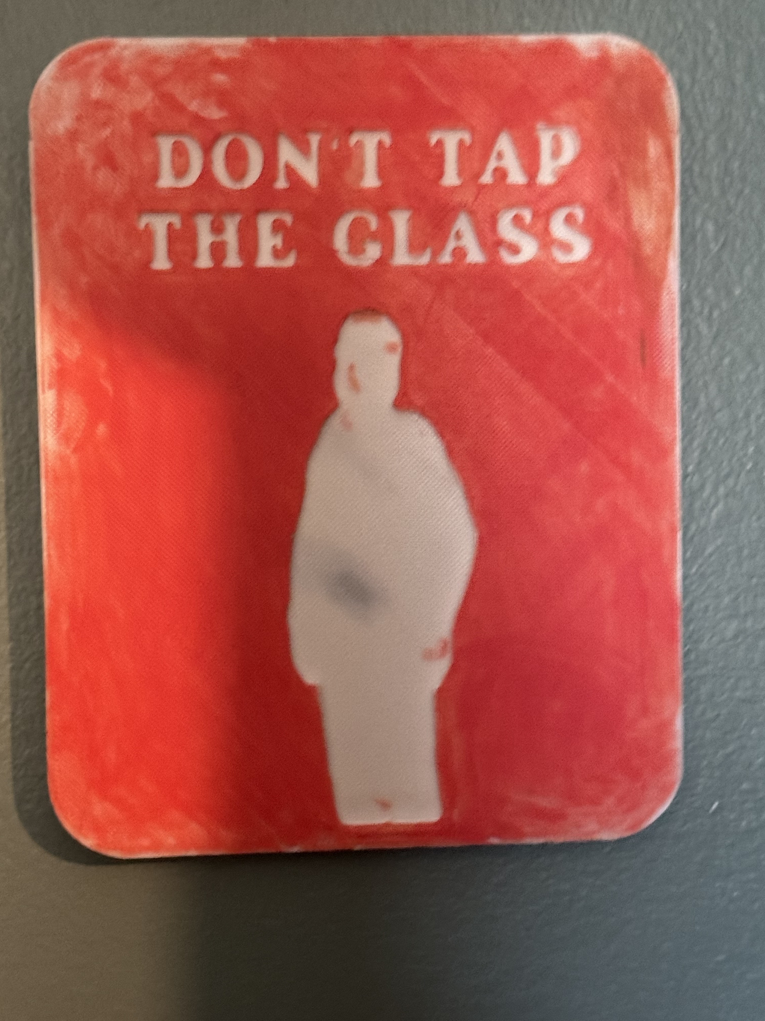 DONT TAP THE GLASS sign