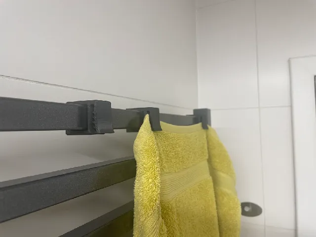 Towel holder for bathroom radiator with square ribs