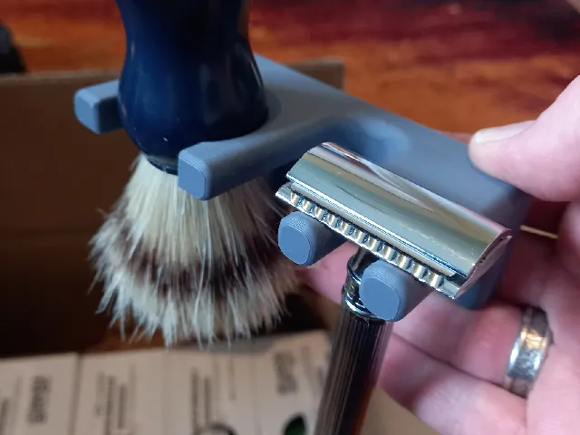Shaving razor and brush holder