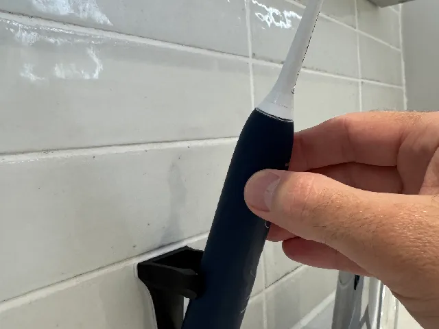 Wall mount for electric toothbrush
