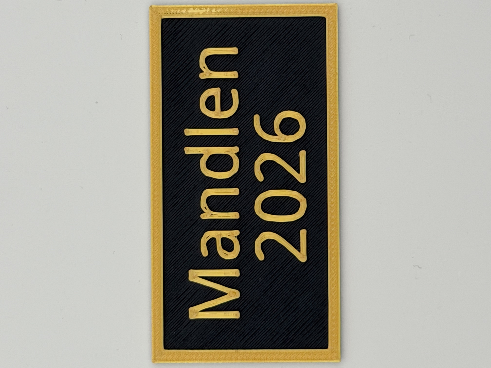 Mandlen 2026 text with frame