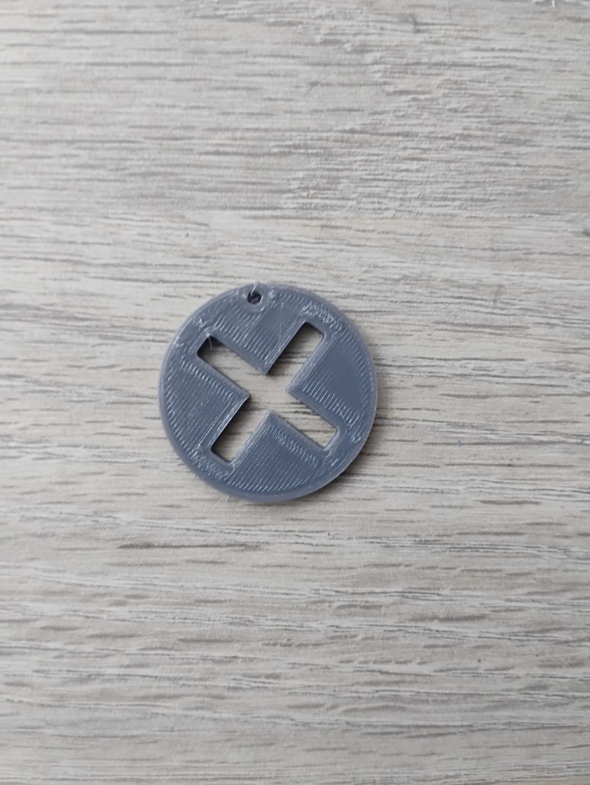 llavero de boton x de playstation