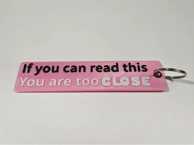 Flame keyring "If you can read, you are too close"