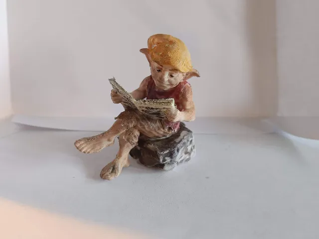 Goblin reading the newspaper