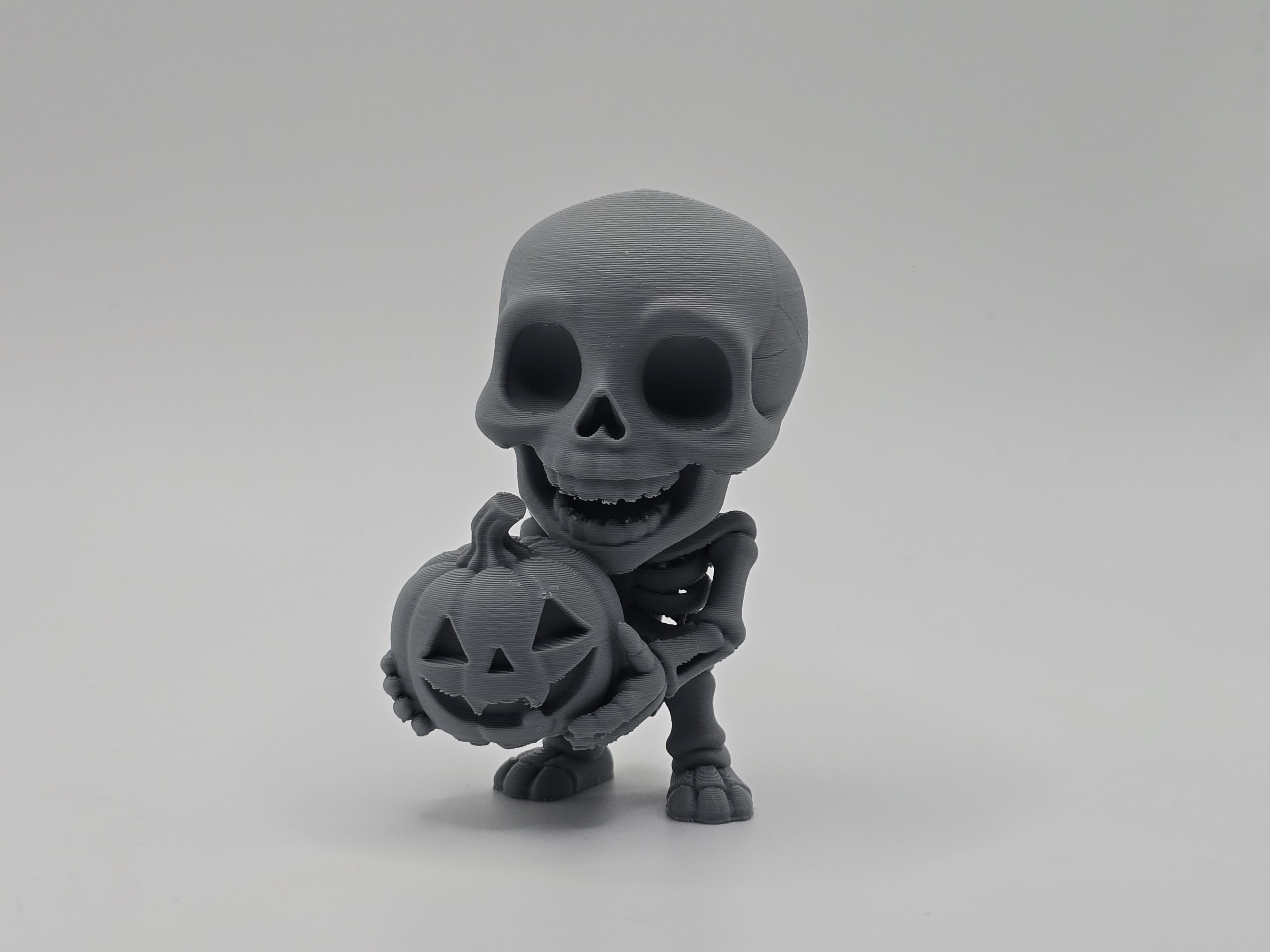 Happy Skeleton with Pumpkin Figurine/Keychain
