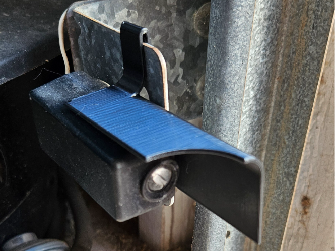 Garage door sensor sun shade