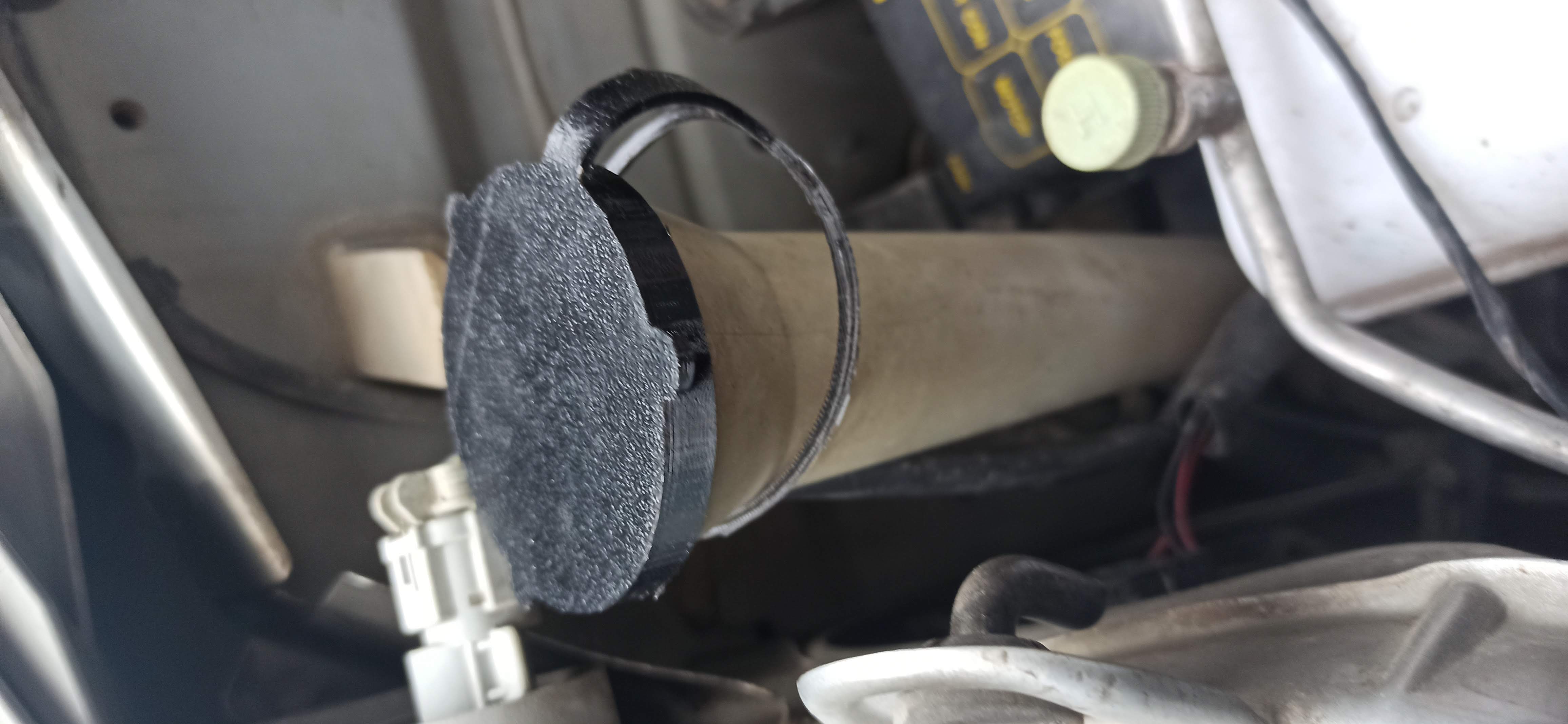 Windshield washer fluid reservoir cap with a 57-60 mm opening.