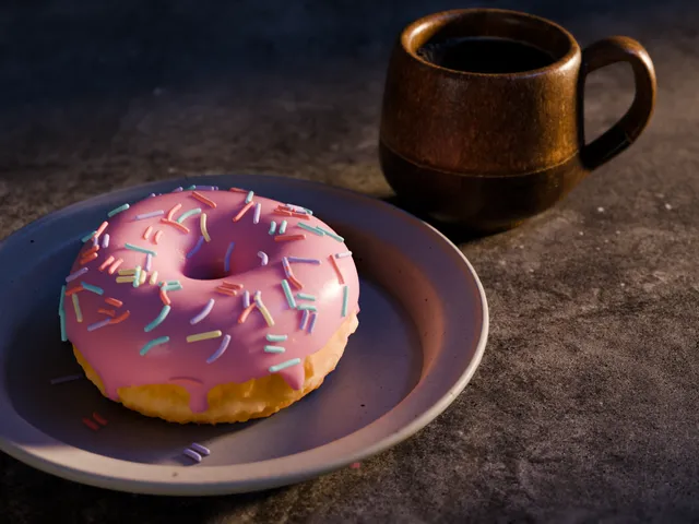 A donut and a cup with coffee made in blender