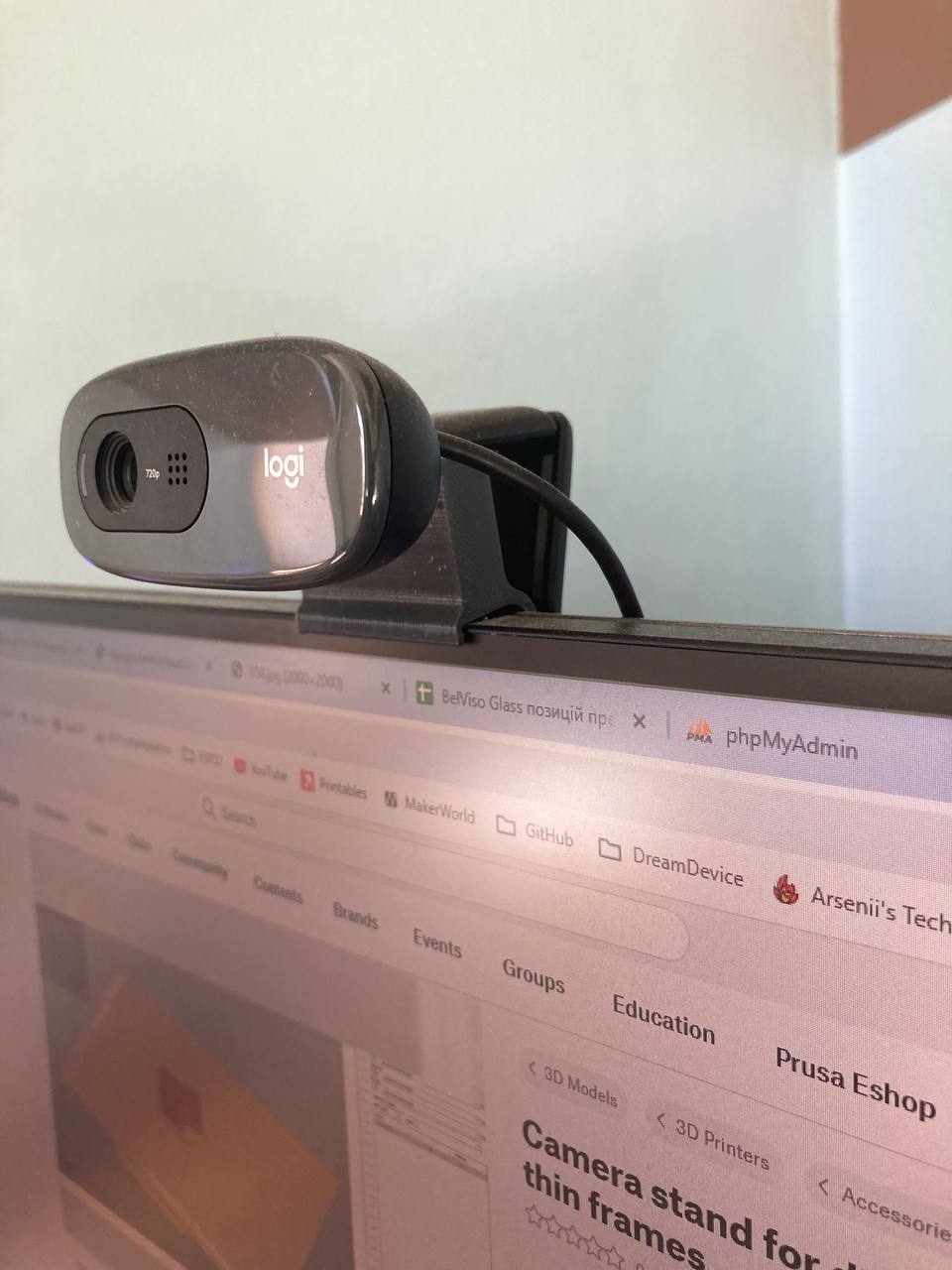 Camera stand for displays with thin frames.