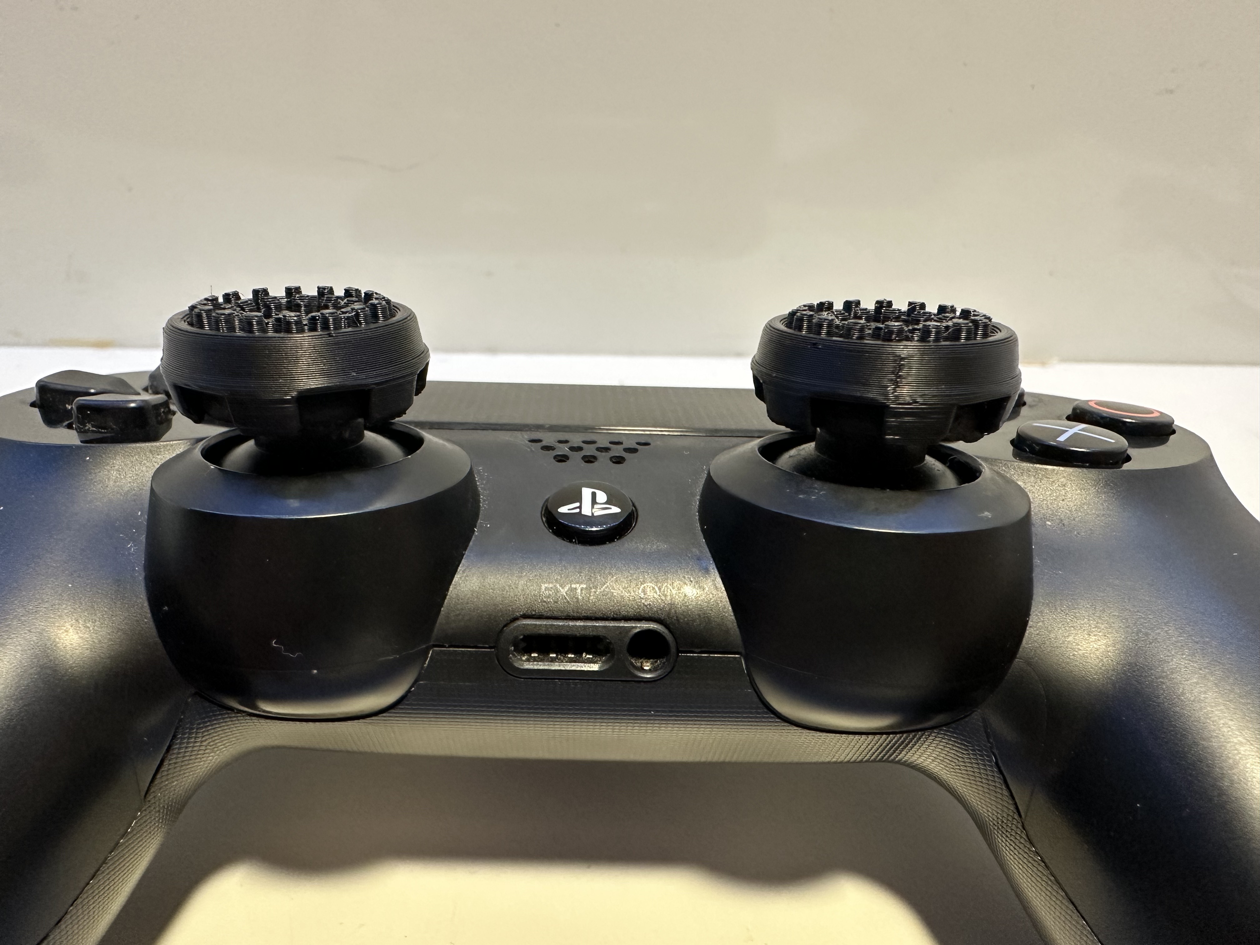 PS4 controller thumb extenders. (They actually fit!)