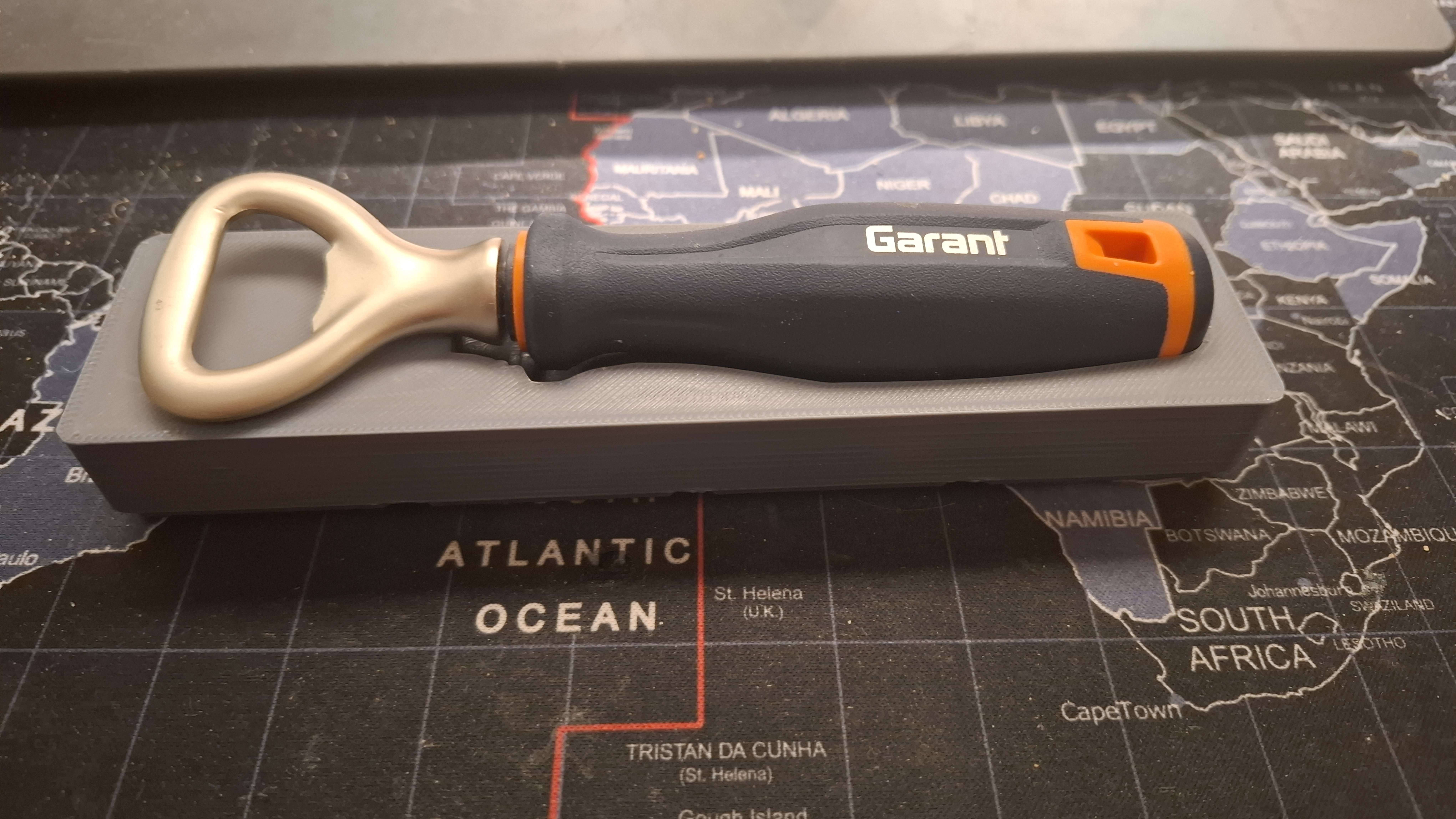 A garant bottle opener holder