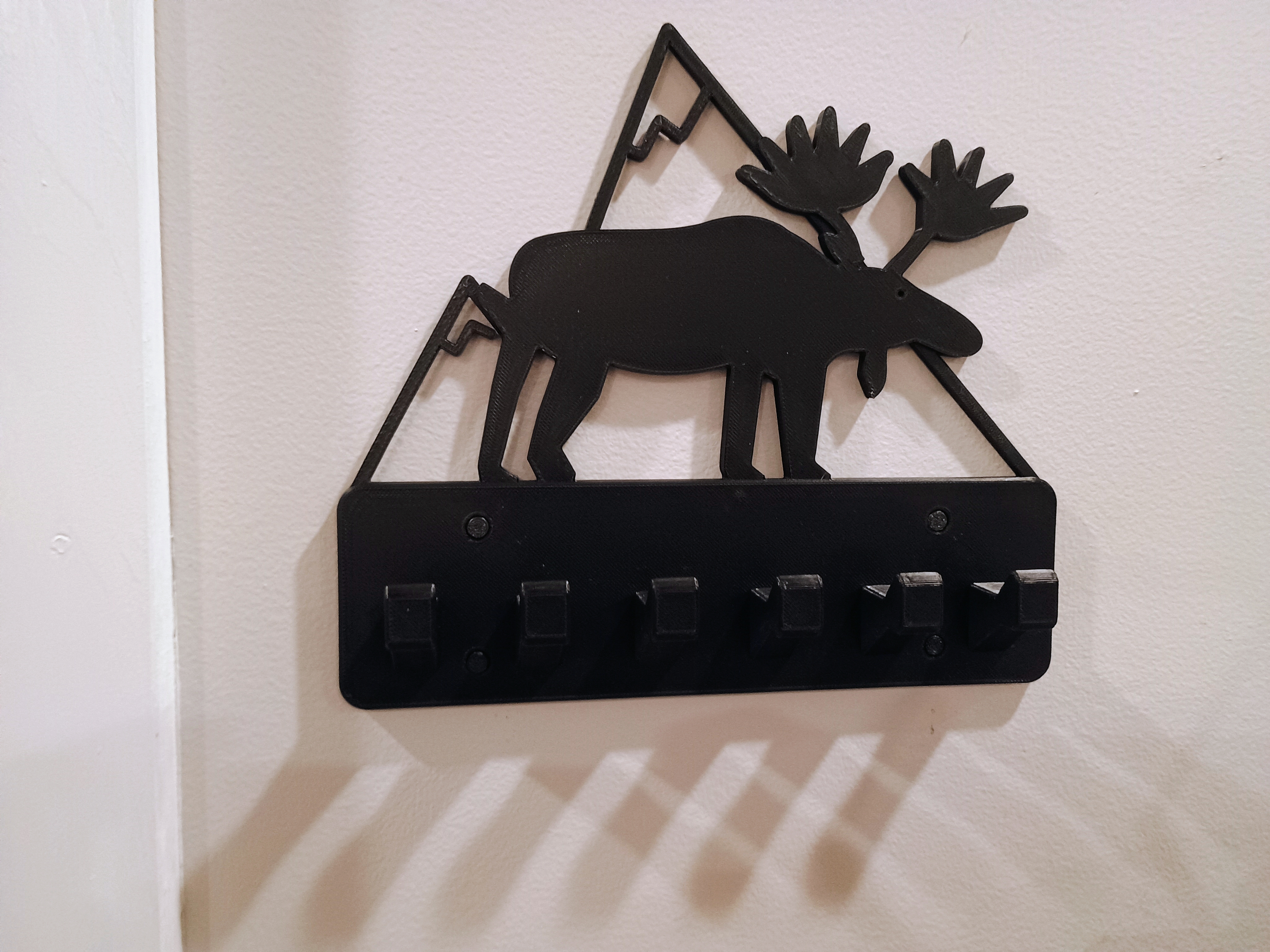 Moose wall mount key holder with drywall plugs