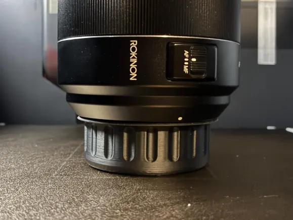 Canon EF Airtag holding rear lens cap