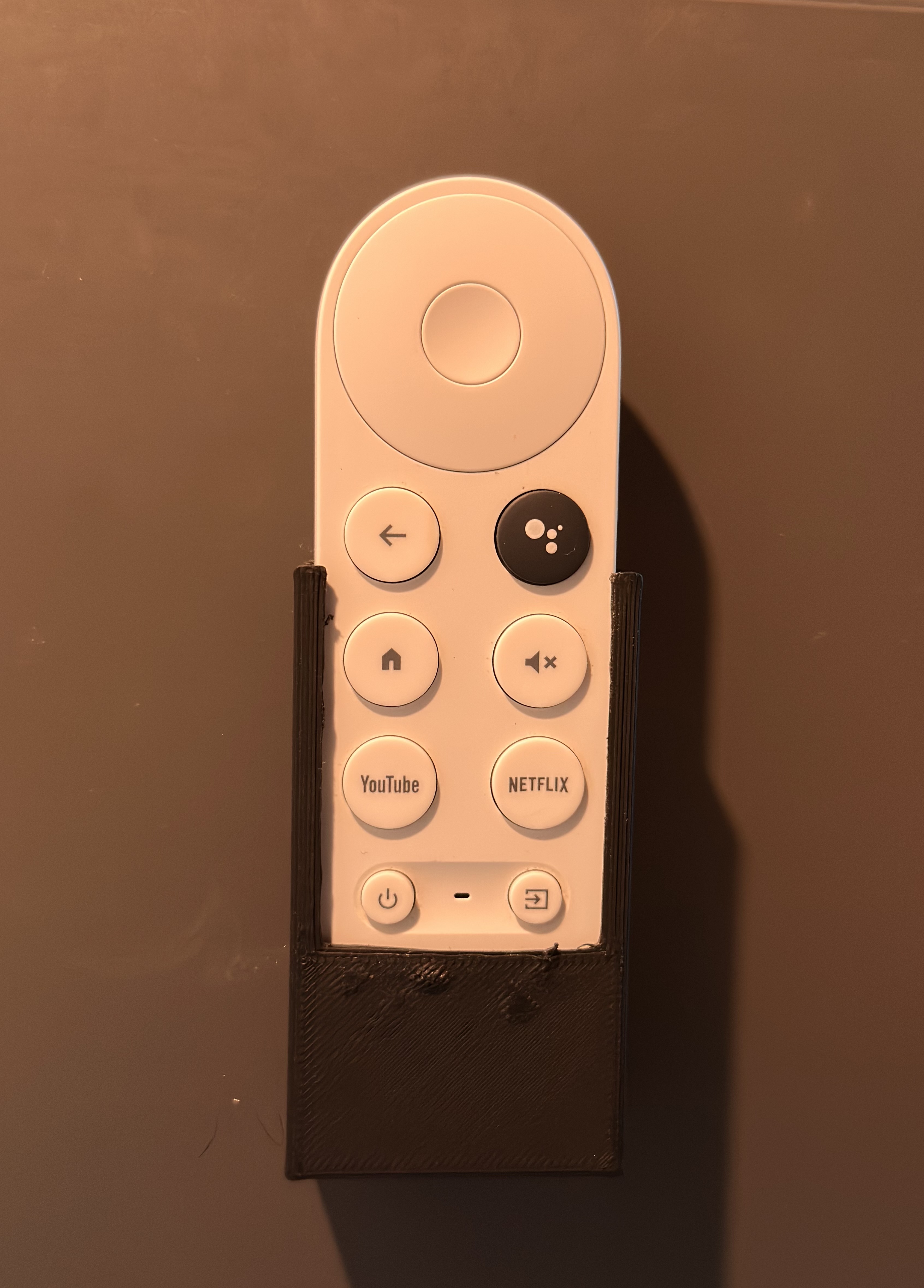 Chromecast remote holder, wall mounted.