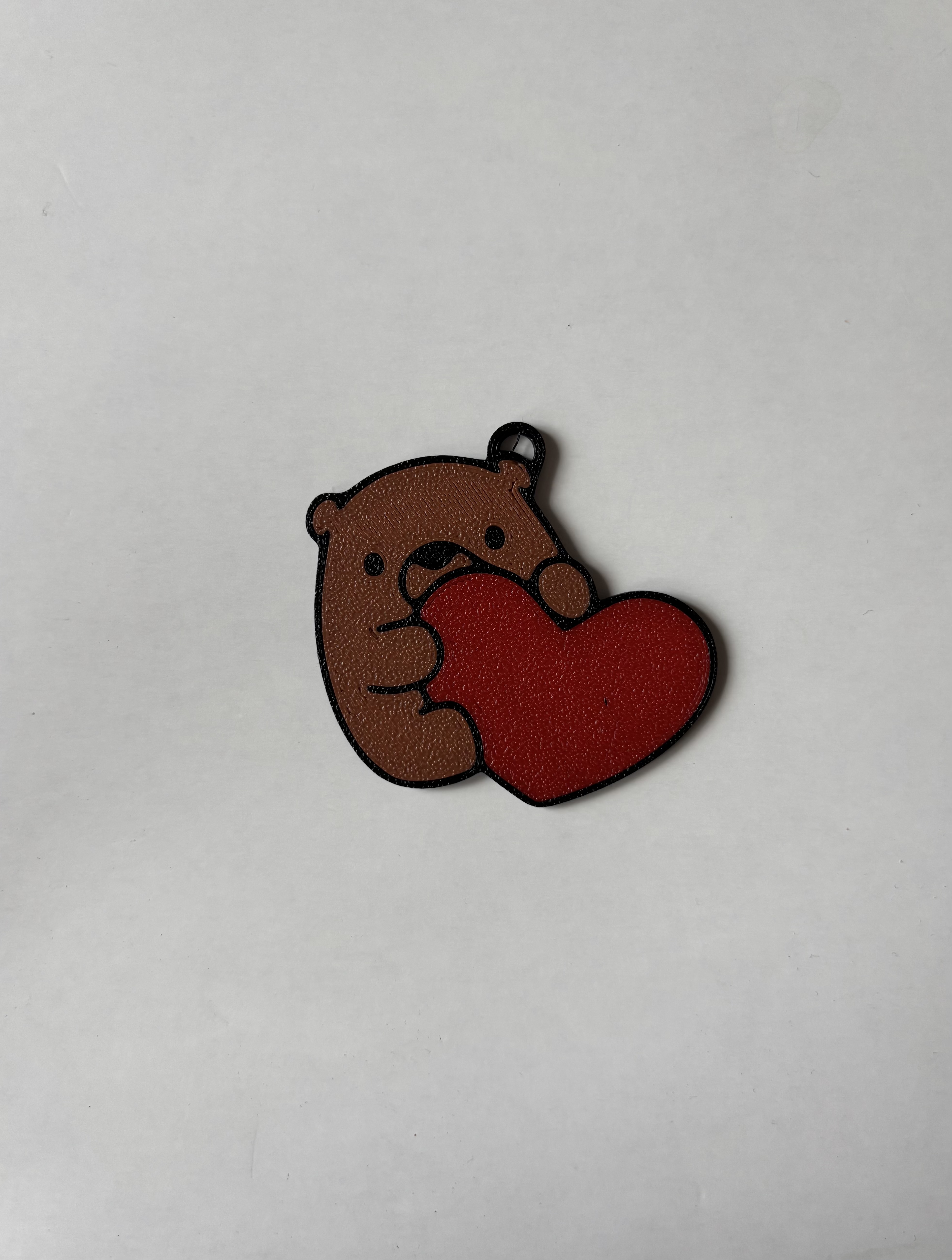 Bear eating heart keychain