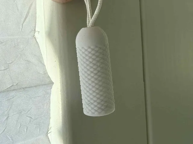 Pull-down knob for blinds or pleated curtains