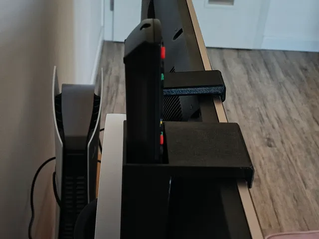 Držák závěsný pro sluchátka za TV